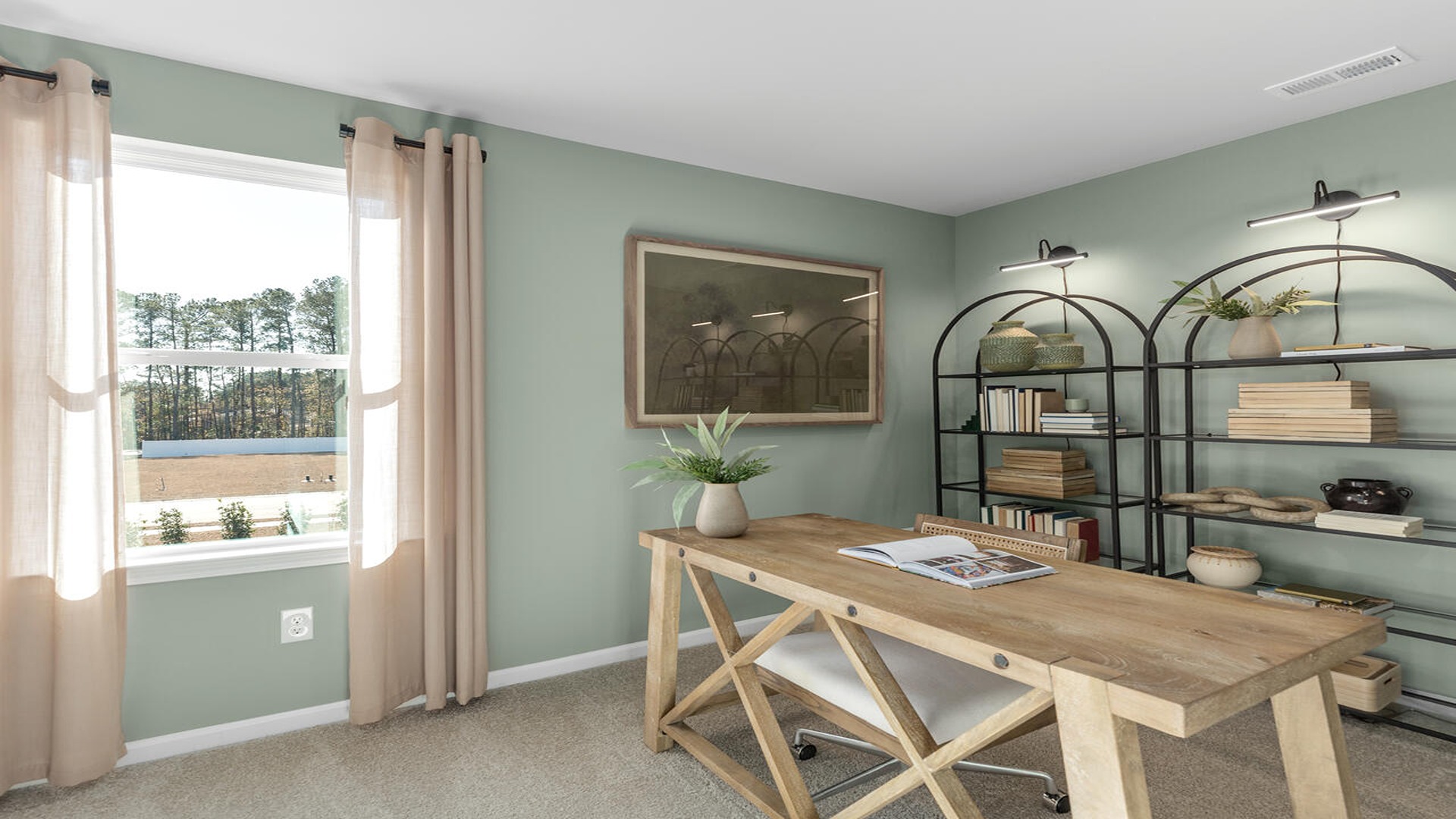 Dedicated home office in the Norman floor plan at Old Bailey by D.R. Horton featuring natural light, flexible workspace, and modern design.