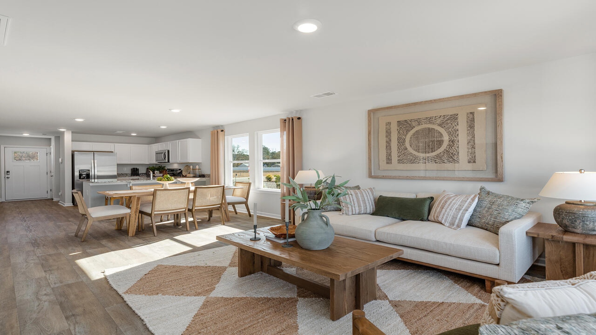 Bright family room in the Norman home designed for everyday comfort, entertaining, and flexible living.