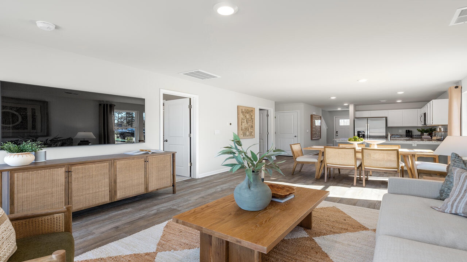 Open-concept living room in the Norman floor plan at Old Bailey featuring spacious gathering areas, abundant natural light, and contemporary finishes.