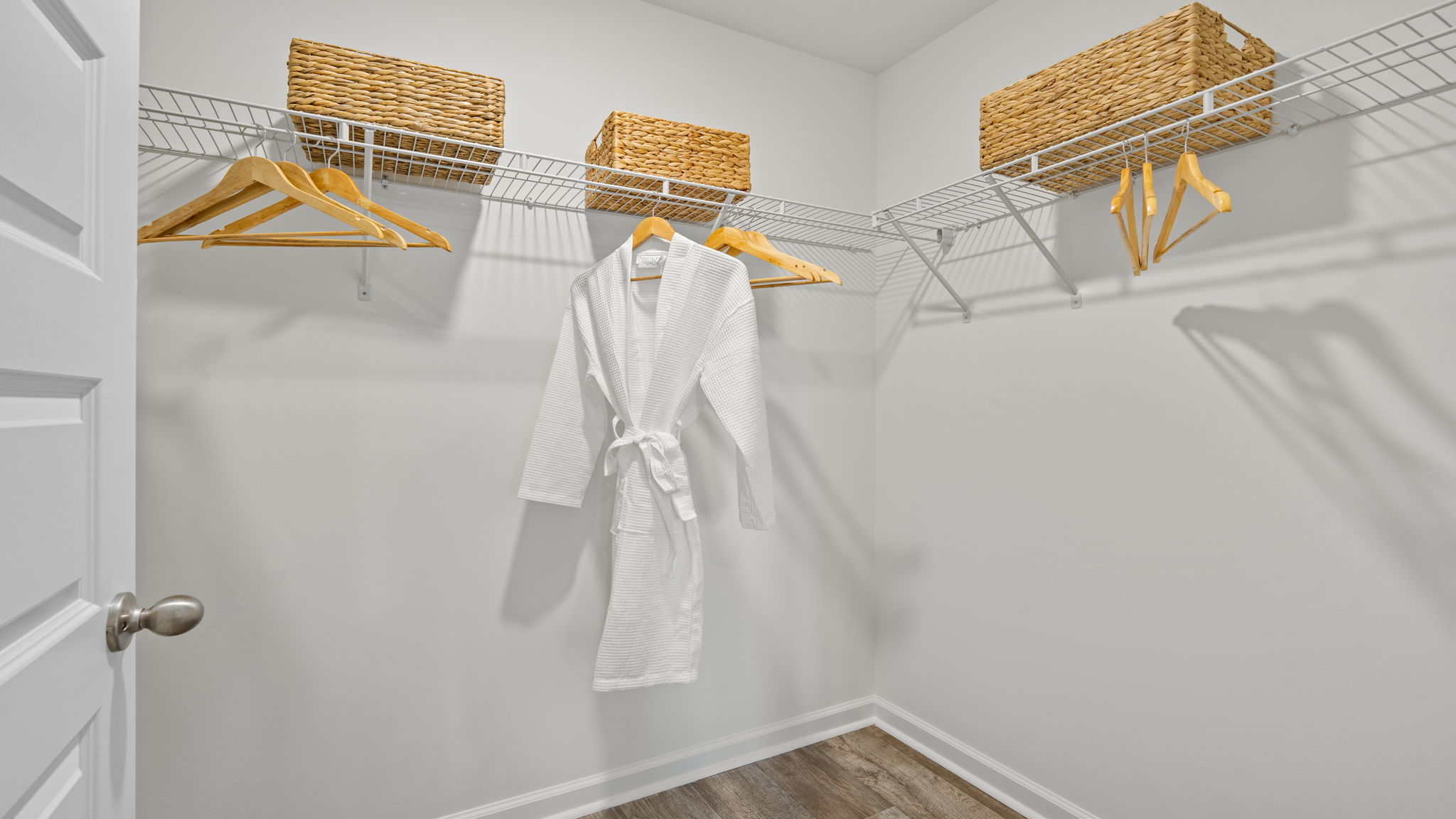 Walk-in closet in the Norman townhome primary suite offering generous storage space
