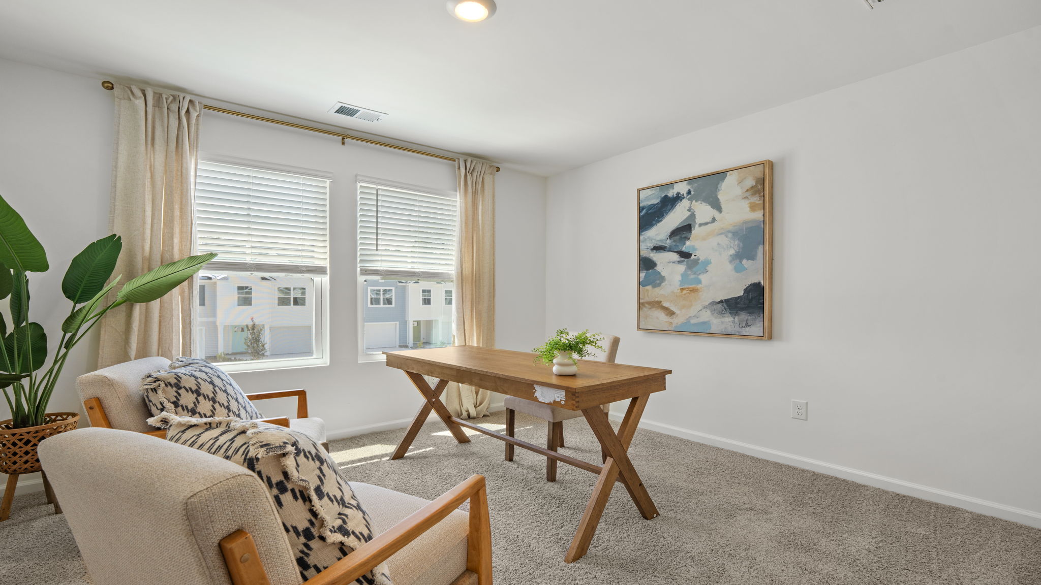 Flex room in the Norman townhome ideal as a home office, guest room, or additional bedroom