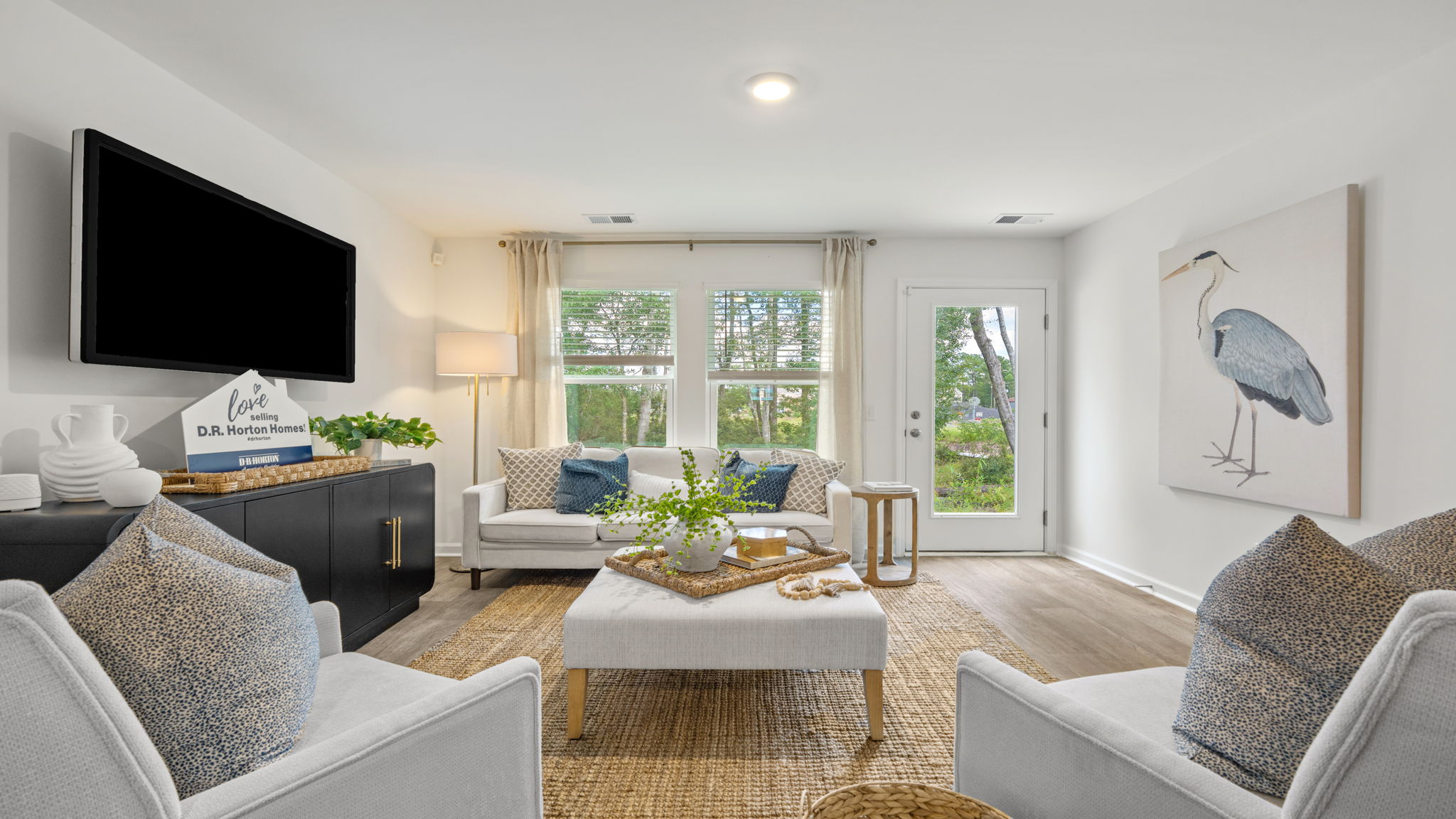Spacious living room in the Norman townhome featuring natural light, open-concept design, and comfortable gathering area