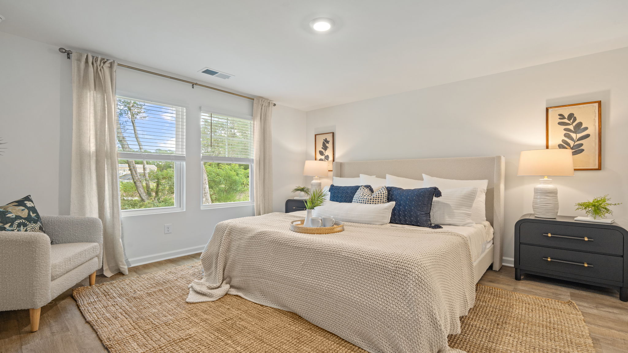 Primary bedroom in the Norman townhome featuring abundant natural light and spacious layout