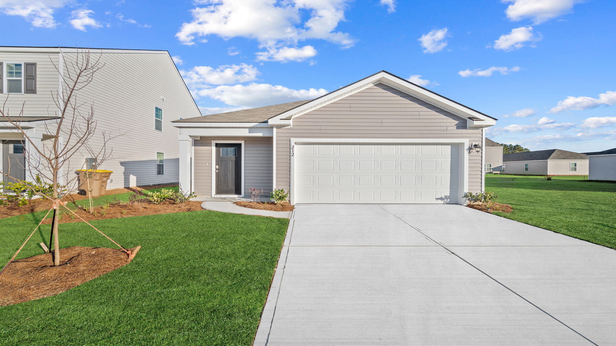 Front exterior of the Downing by D.R. Horton at The Groves at Bees Creek in Ridgeland, SC