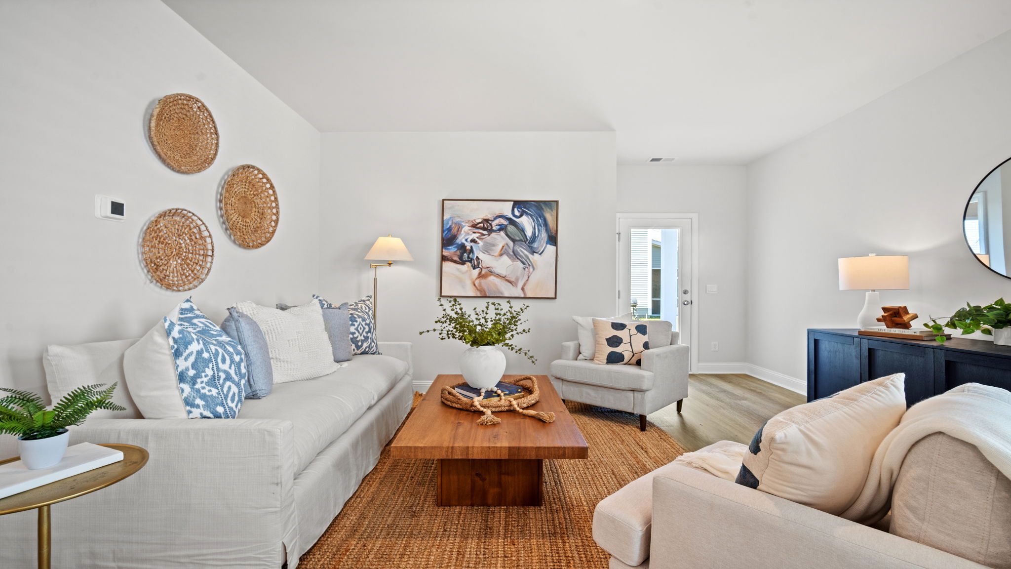 Living room decorated with seating and tables