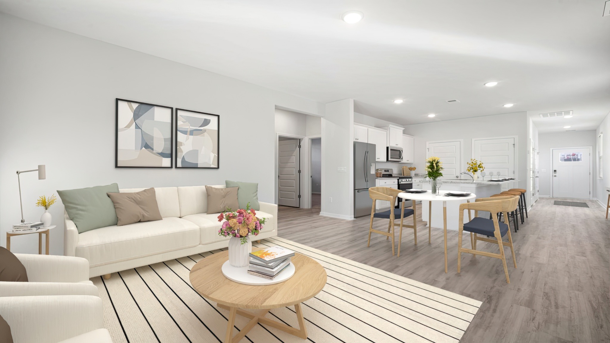 Living room with a couch , chairs and a table