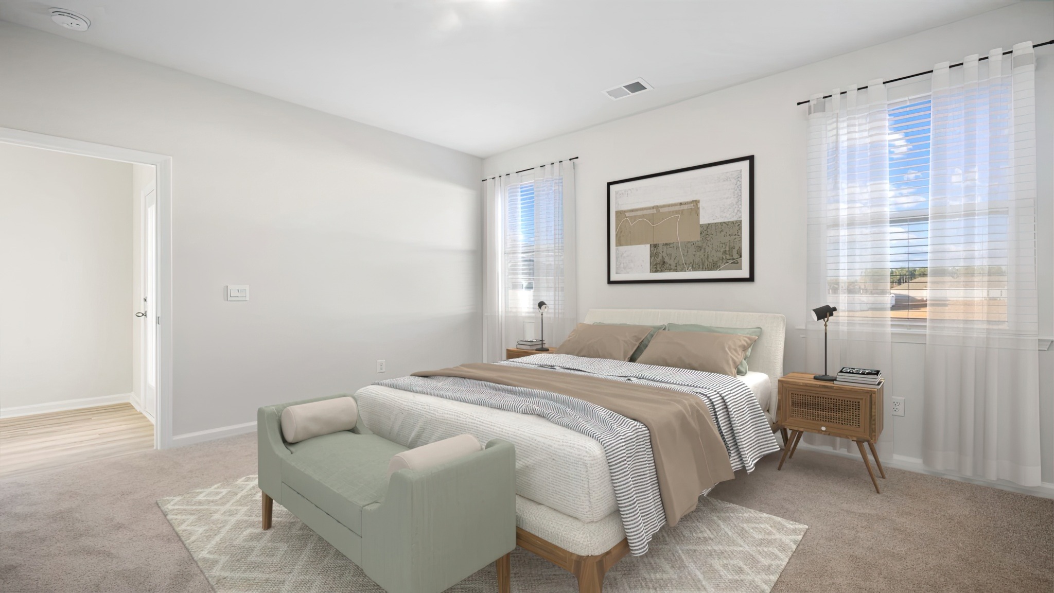 Primary bedroom decorated with a bed, bench and side table