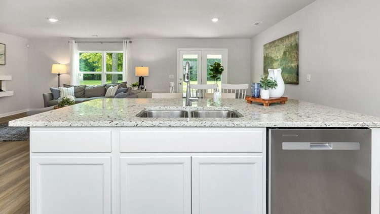 Kitchen island with a stainless dishwasher