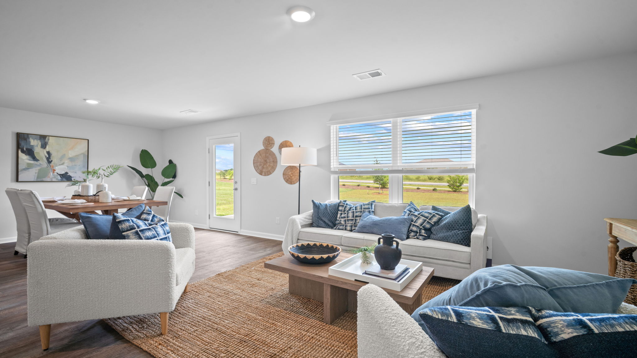 Bright family room in the Freeport home connected seamlessly to the kitchen and dining area