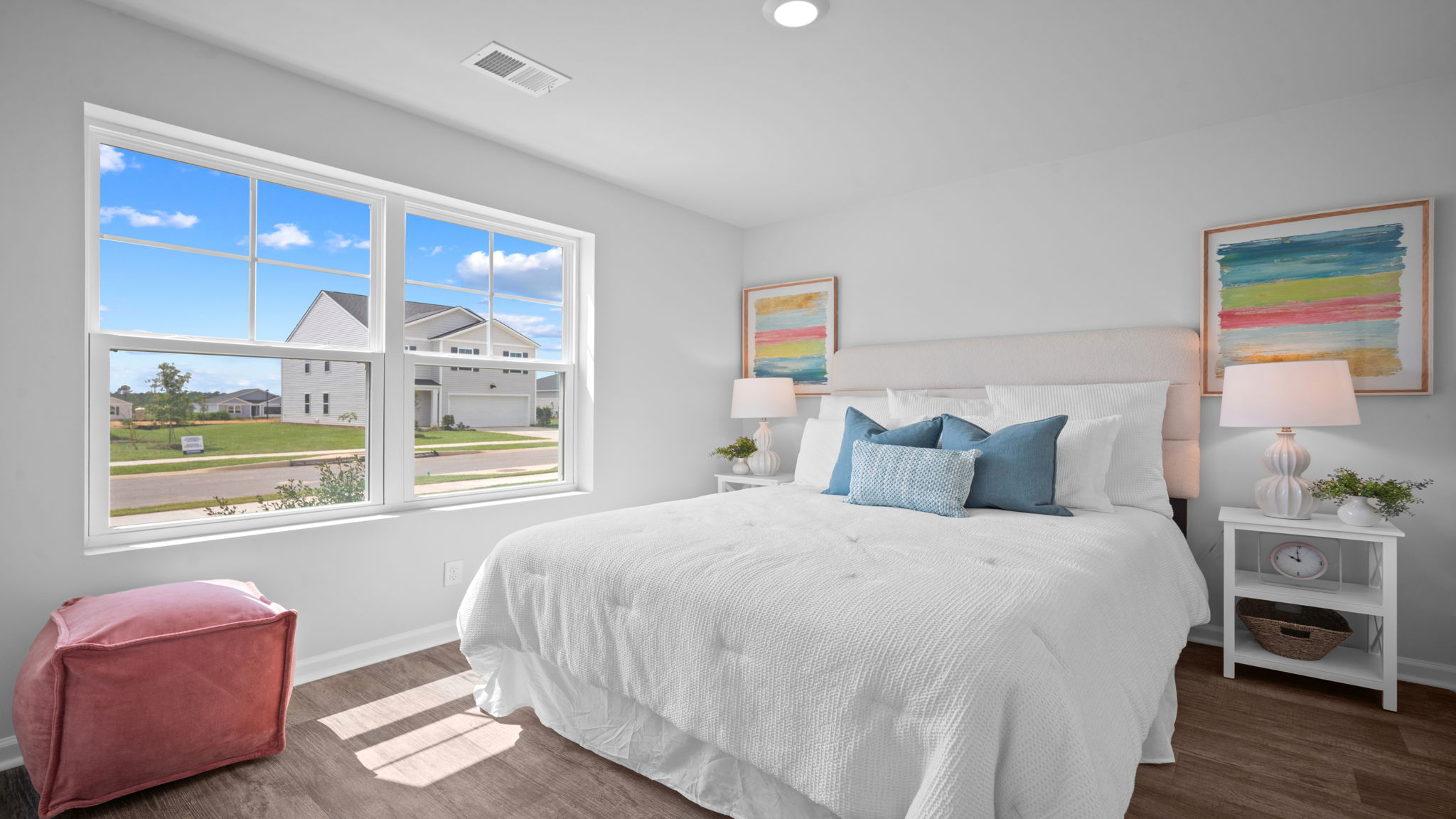 Cozy guest bedroom featuring natural light