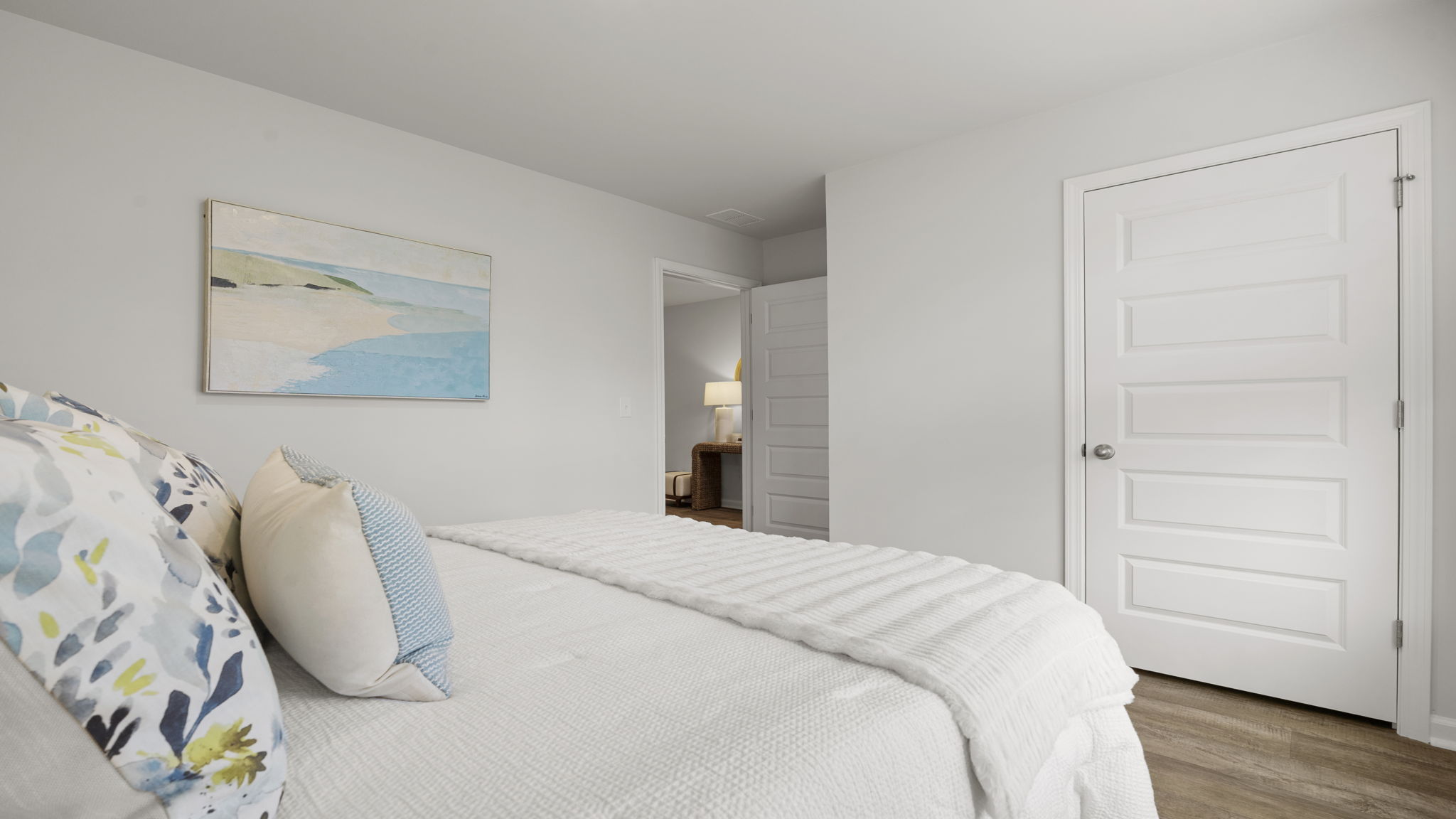 Well-appointed secondary bedroom with closet space and bright interior design.