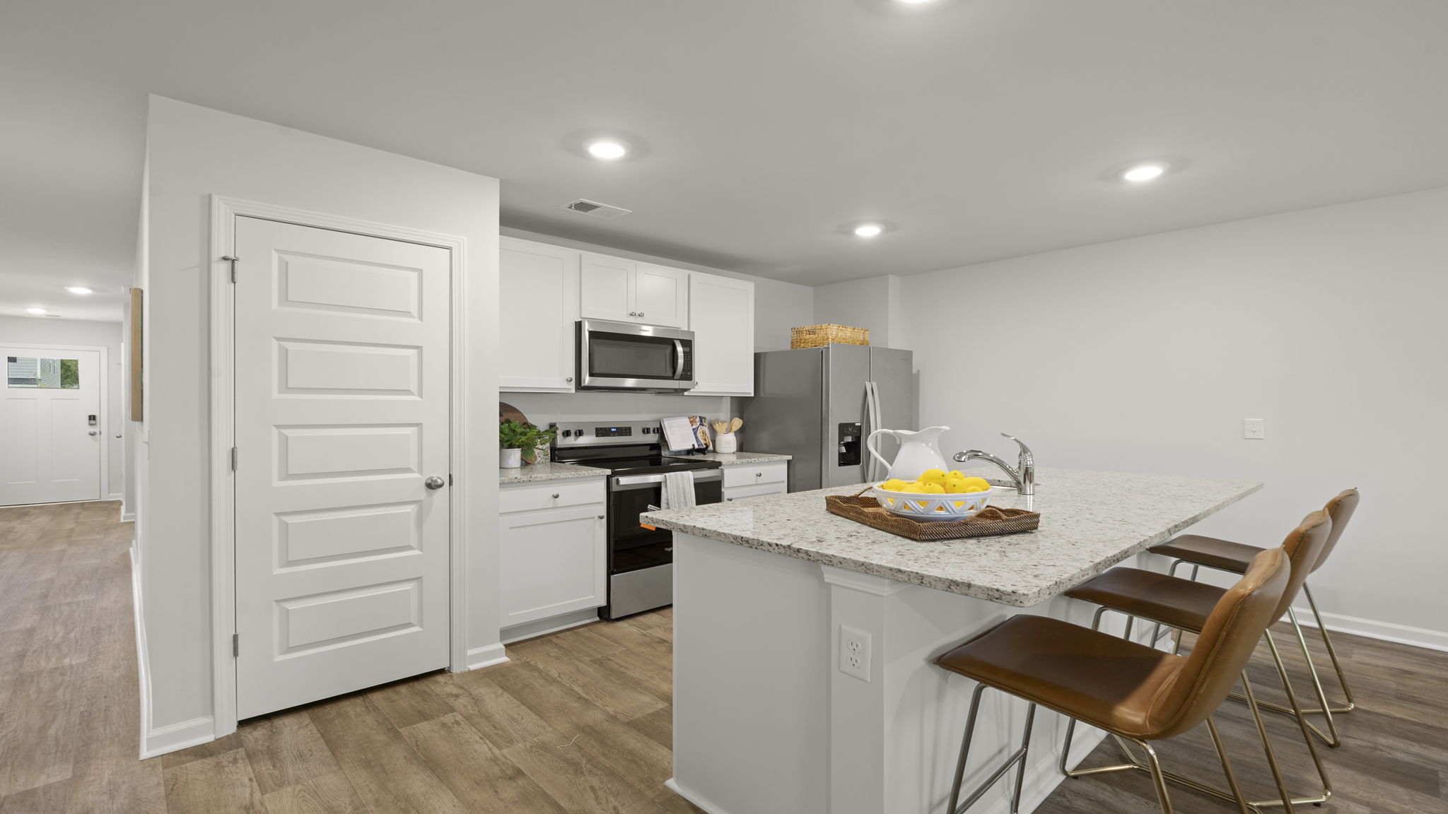 Kitchen and dining space featuring large island, modern finishes, and seamless connection to the main living areas.