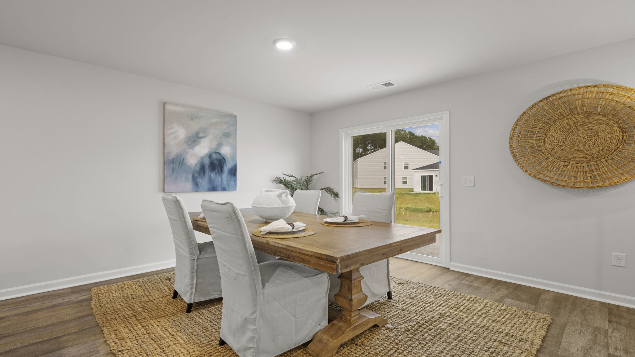 Dedicated dining area with open-concept design, stylish finishes, and easy access to kitchen and living spaces.