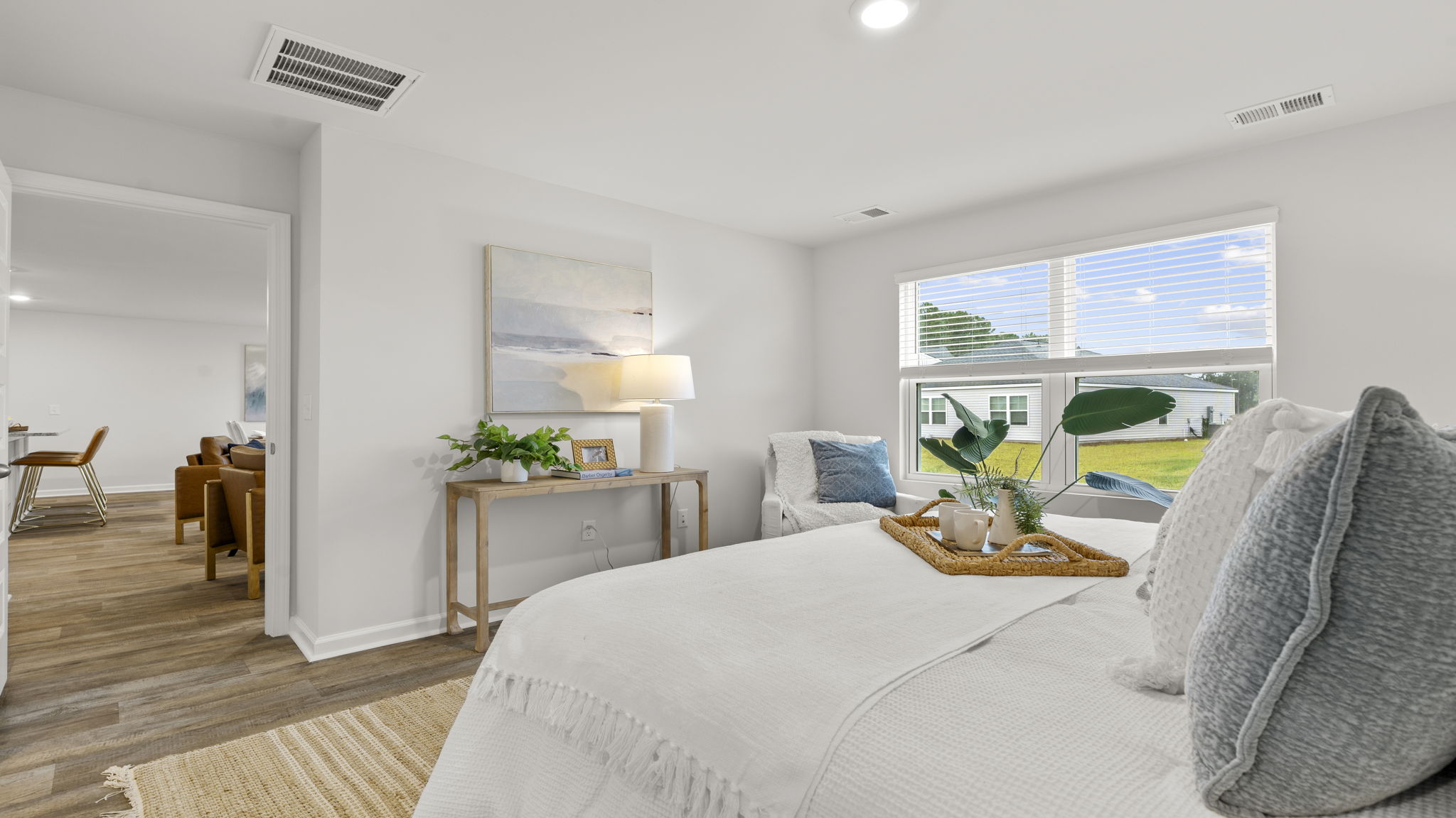 Private owner's suite featuring generous bedroom space and peaceful backyard views.
