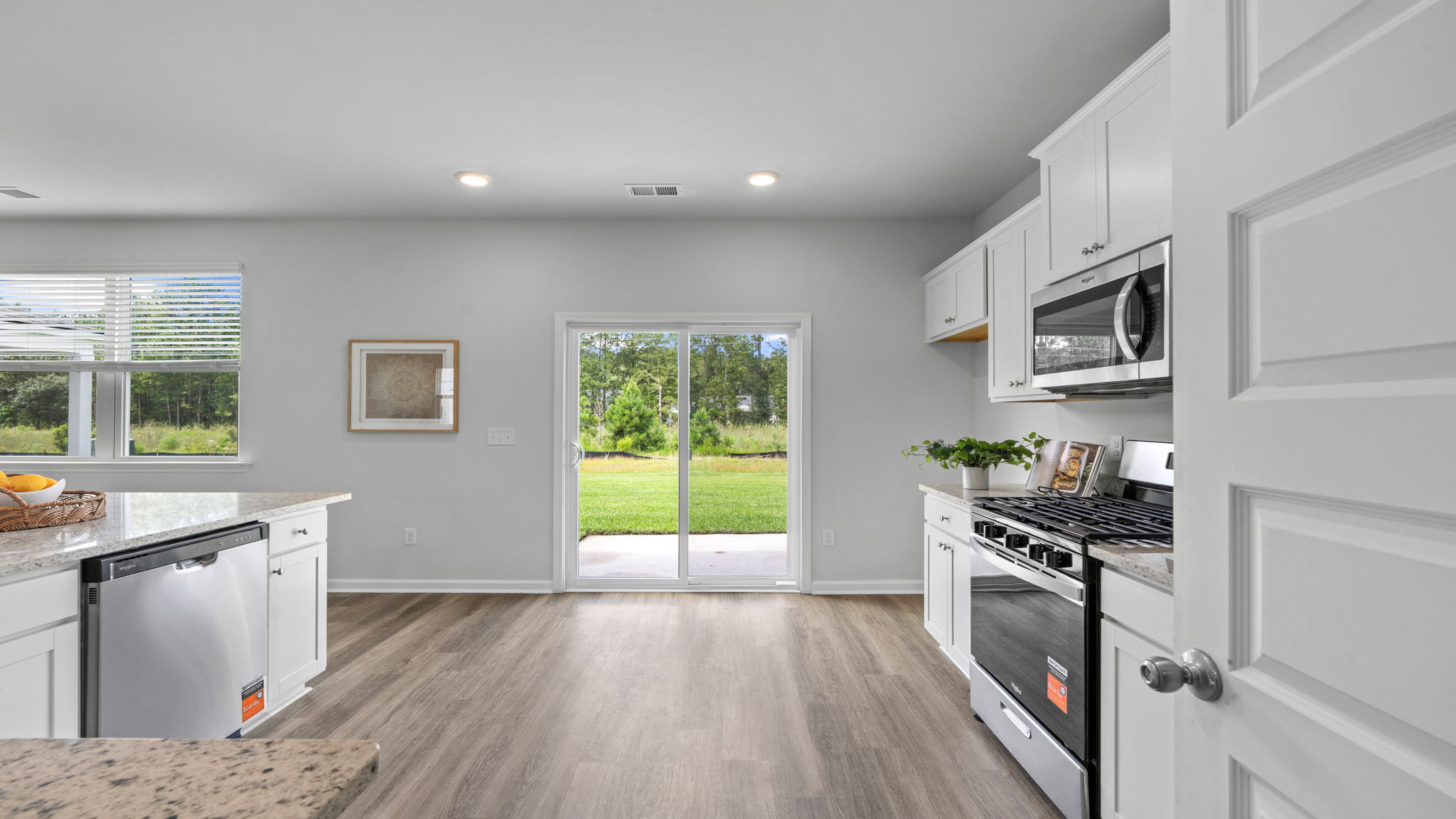 Spacious kitchen and dining area with sliding glass doors