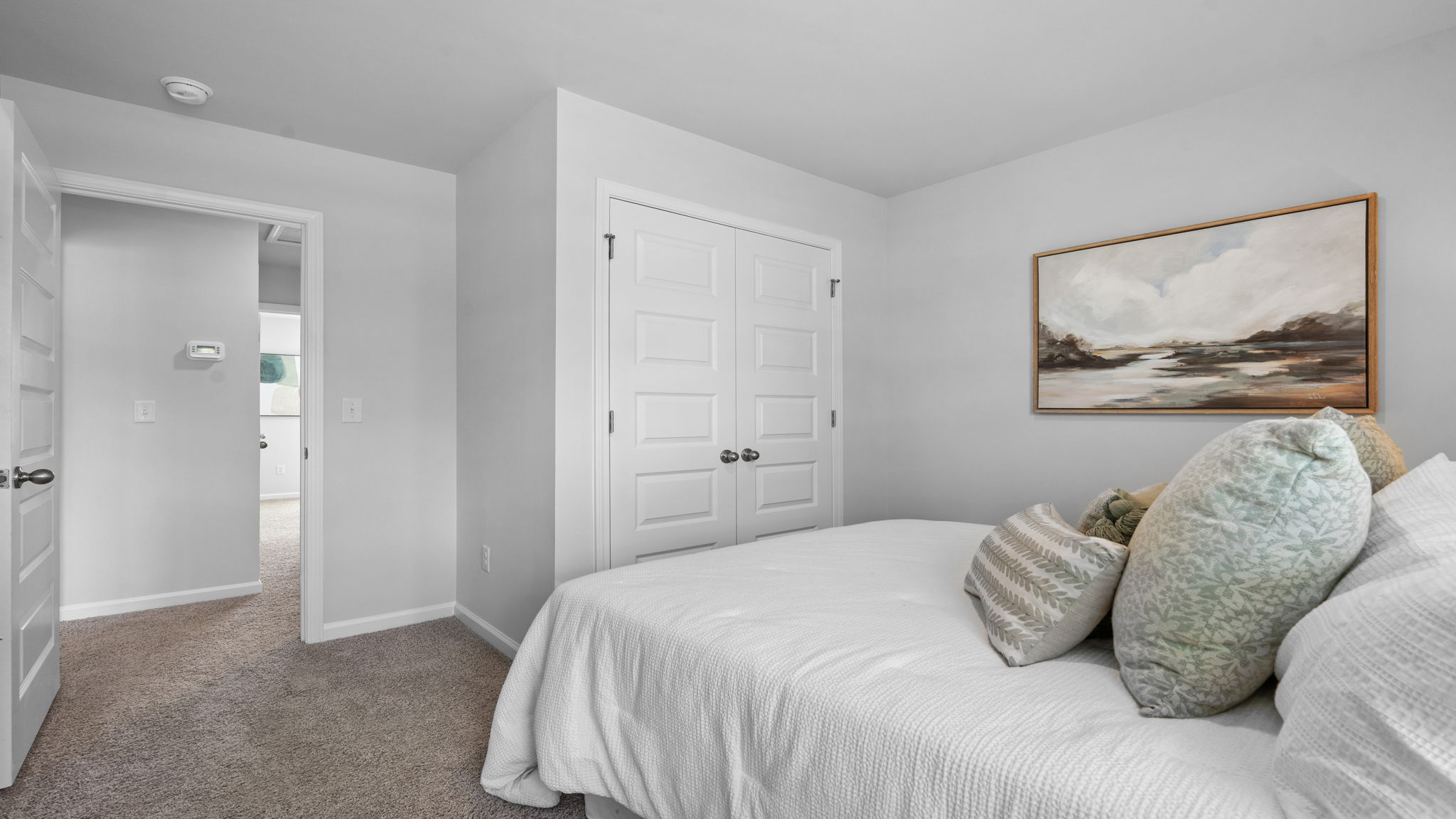 Bedroom with closet and neutral interior finishes