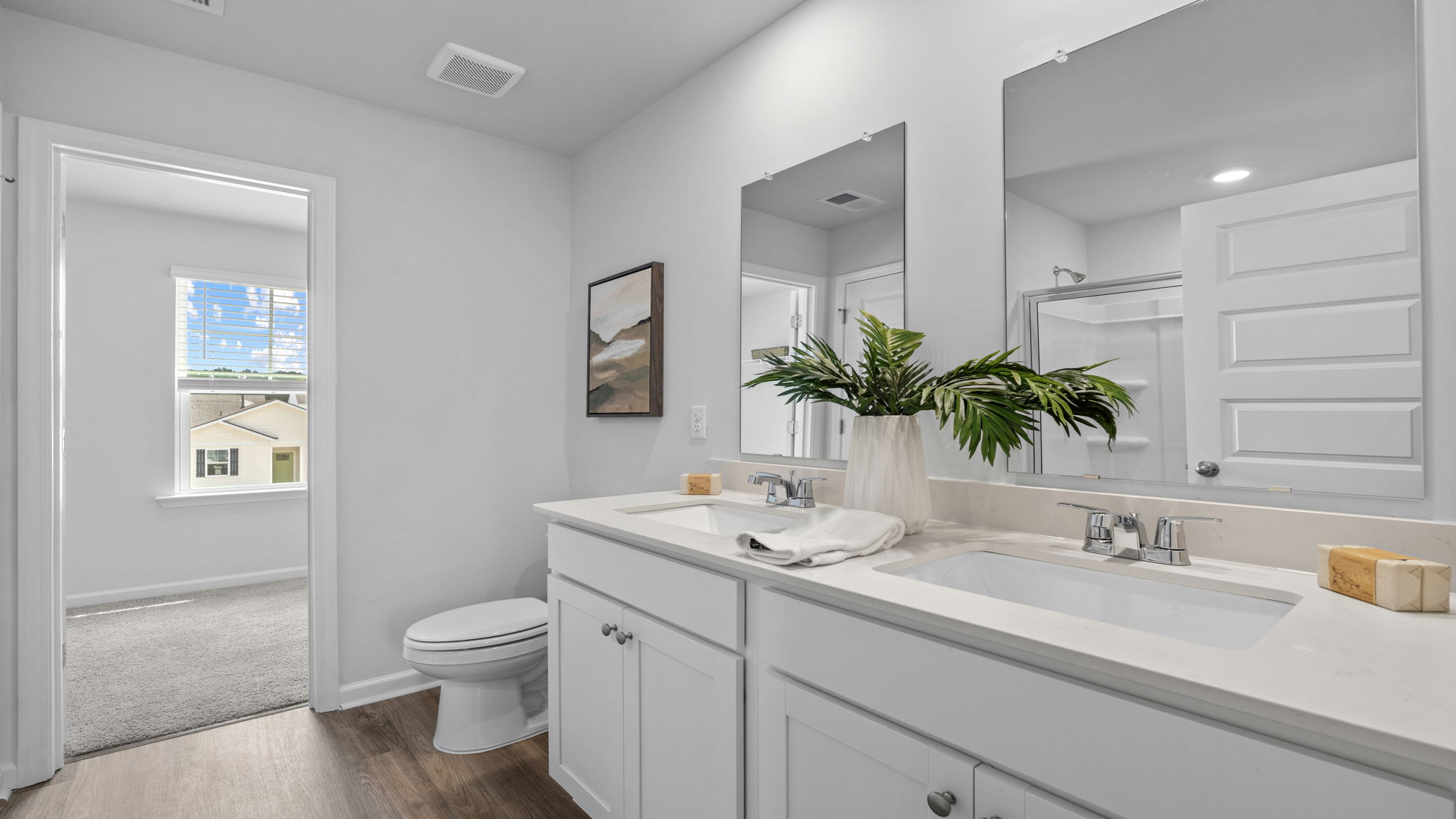 Bathroom with vanity, mirror, and walk-in shower