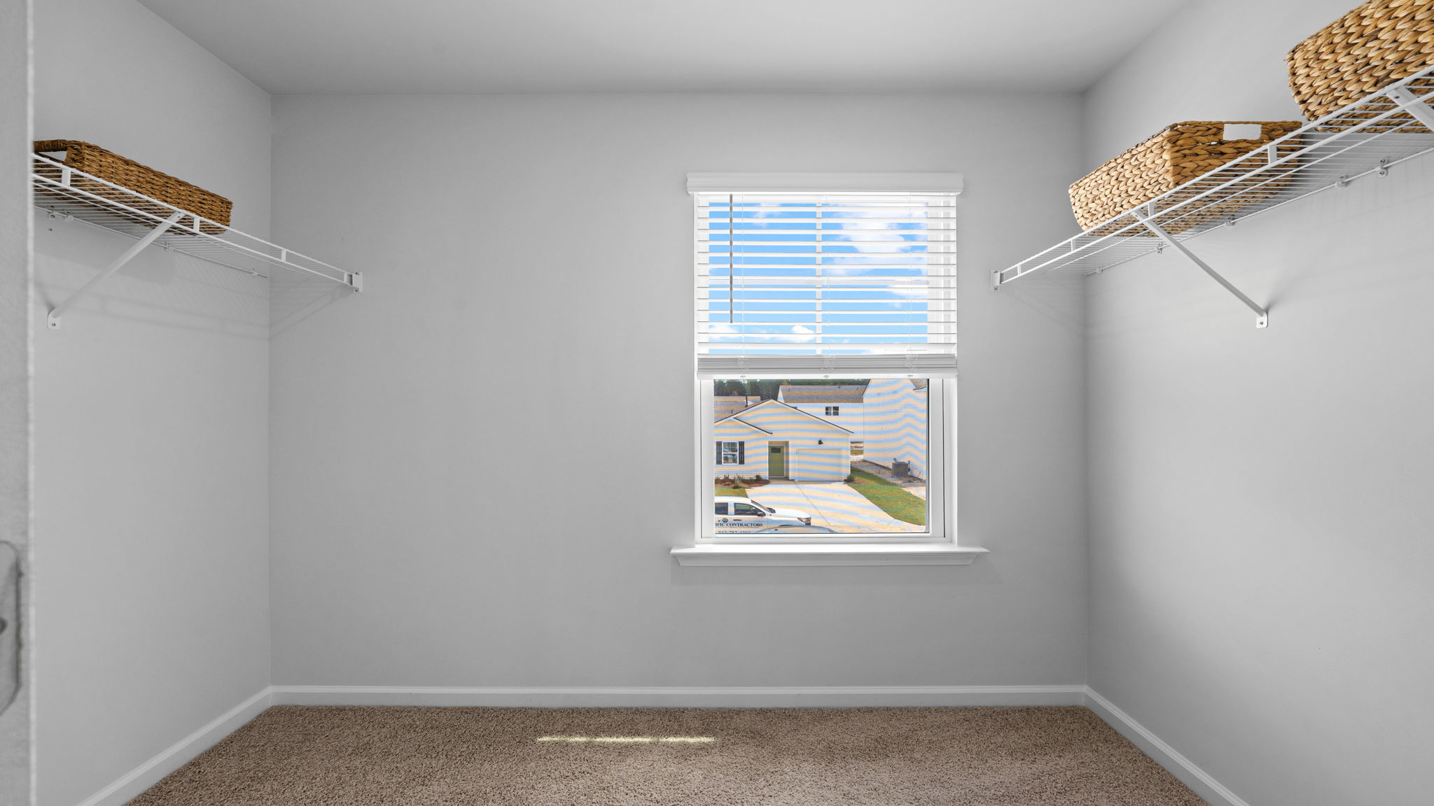 Walk-in closet with built-in shelving and storage