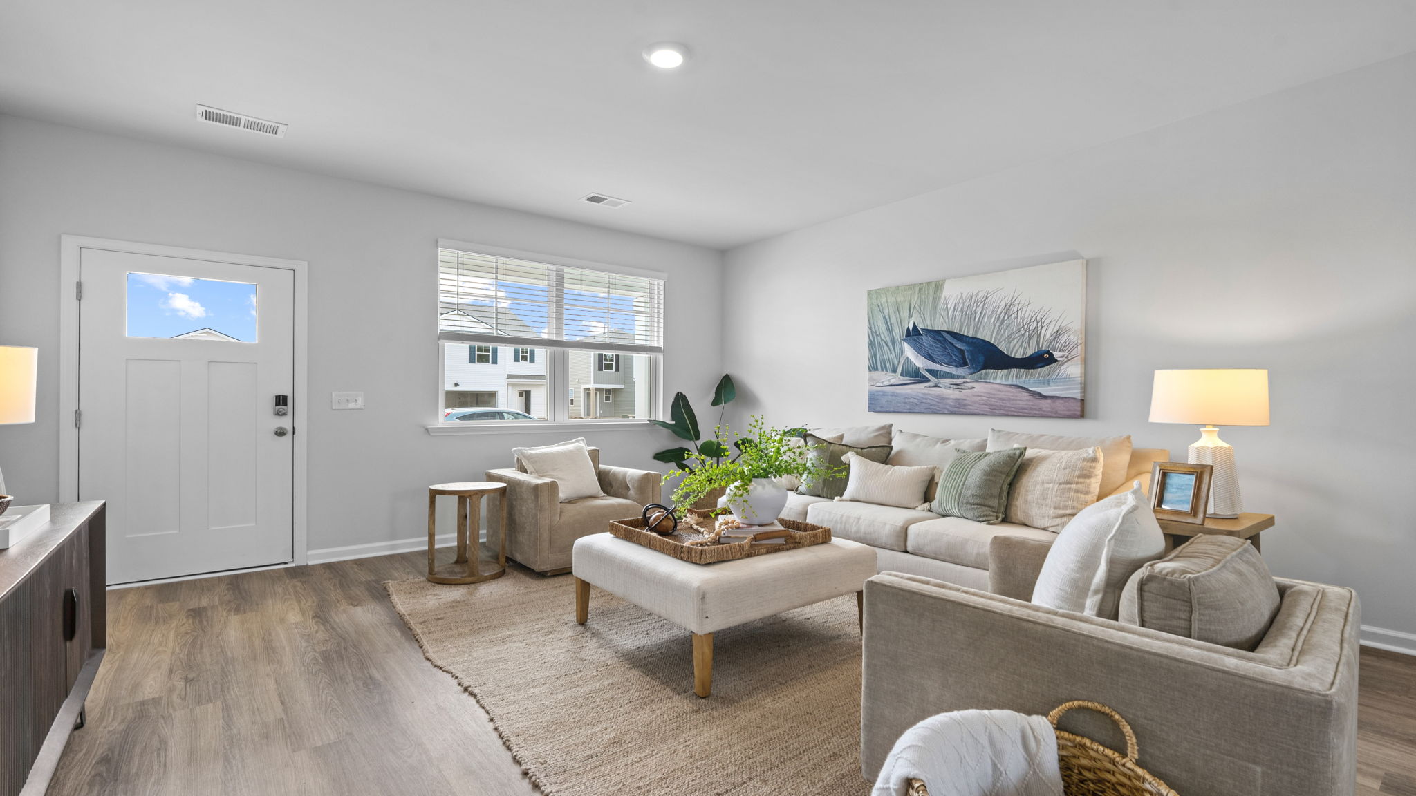 Spacious living room and dining area with wood-look flooring