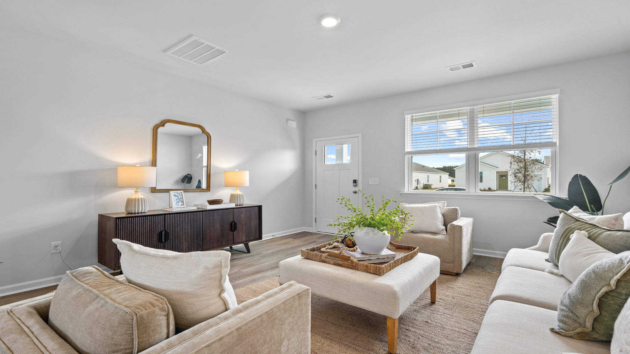 Open living area with adjoining kitchen and dining space