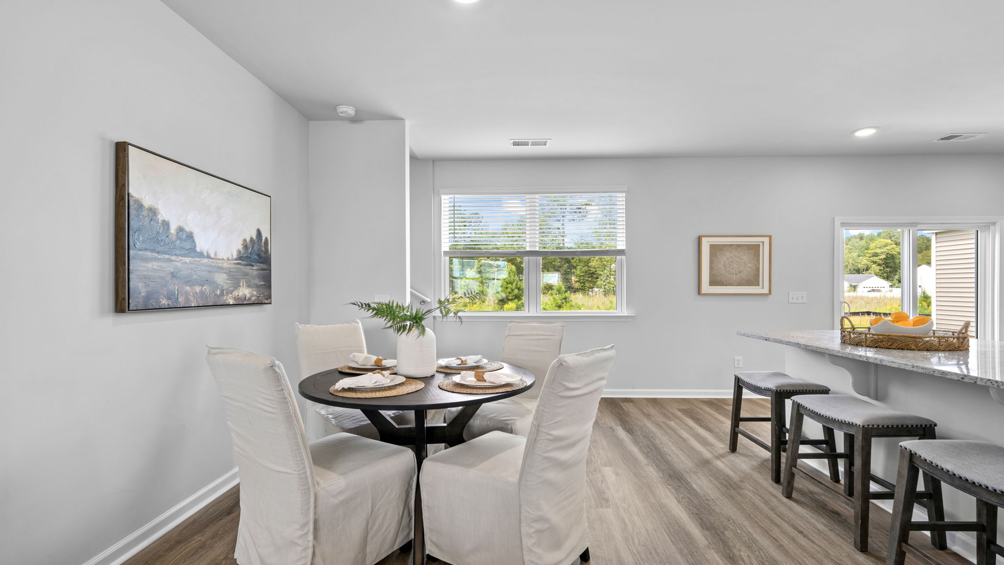 Dining space with large windows and open-concept layout