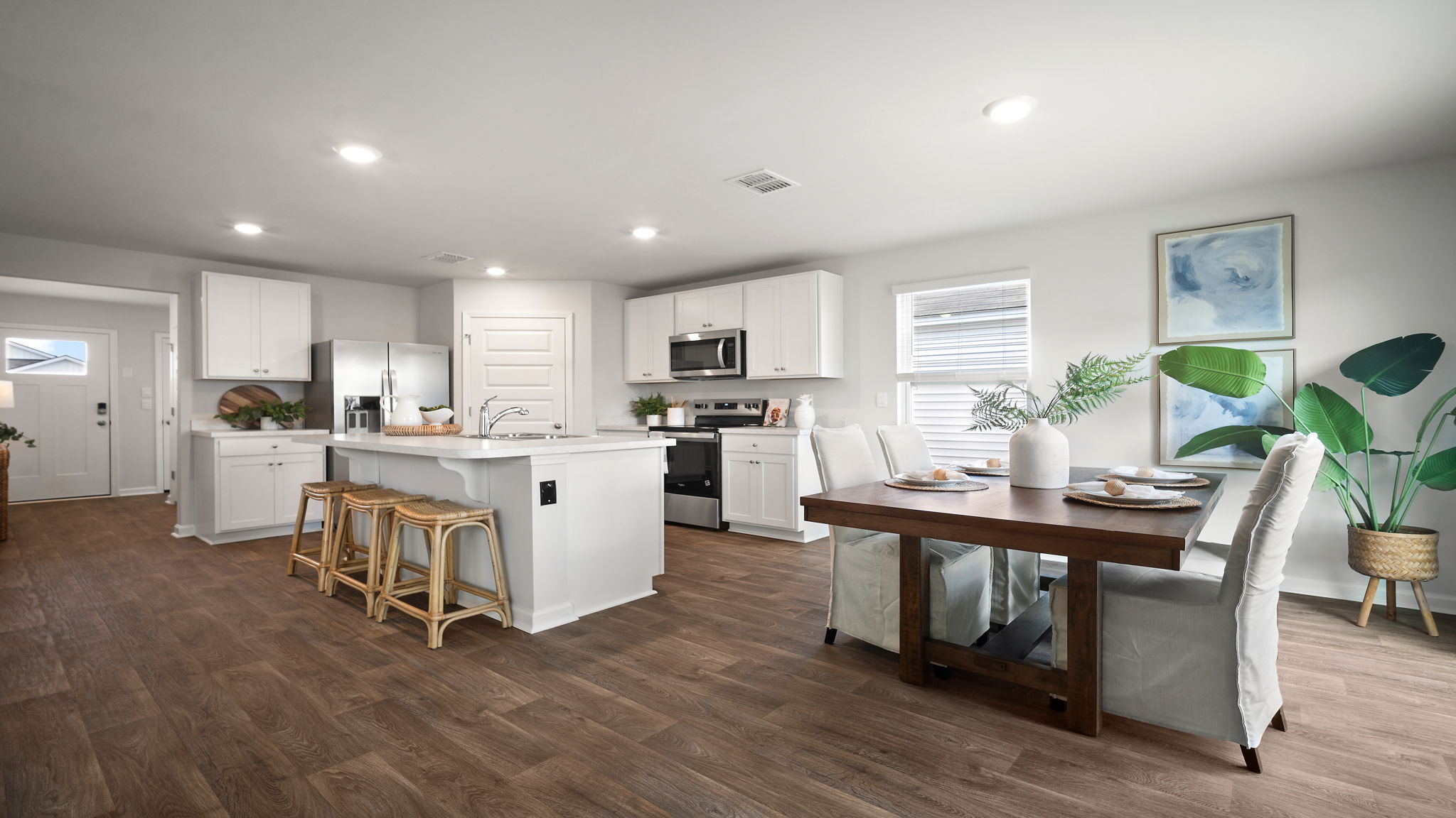 Modern open floor plan of the living, kitchen, and dining area. and dining area.