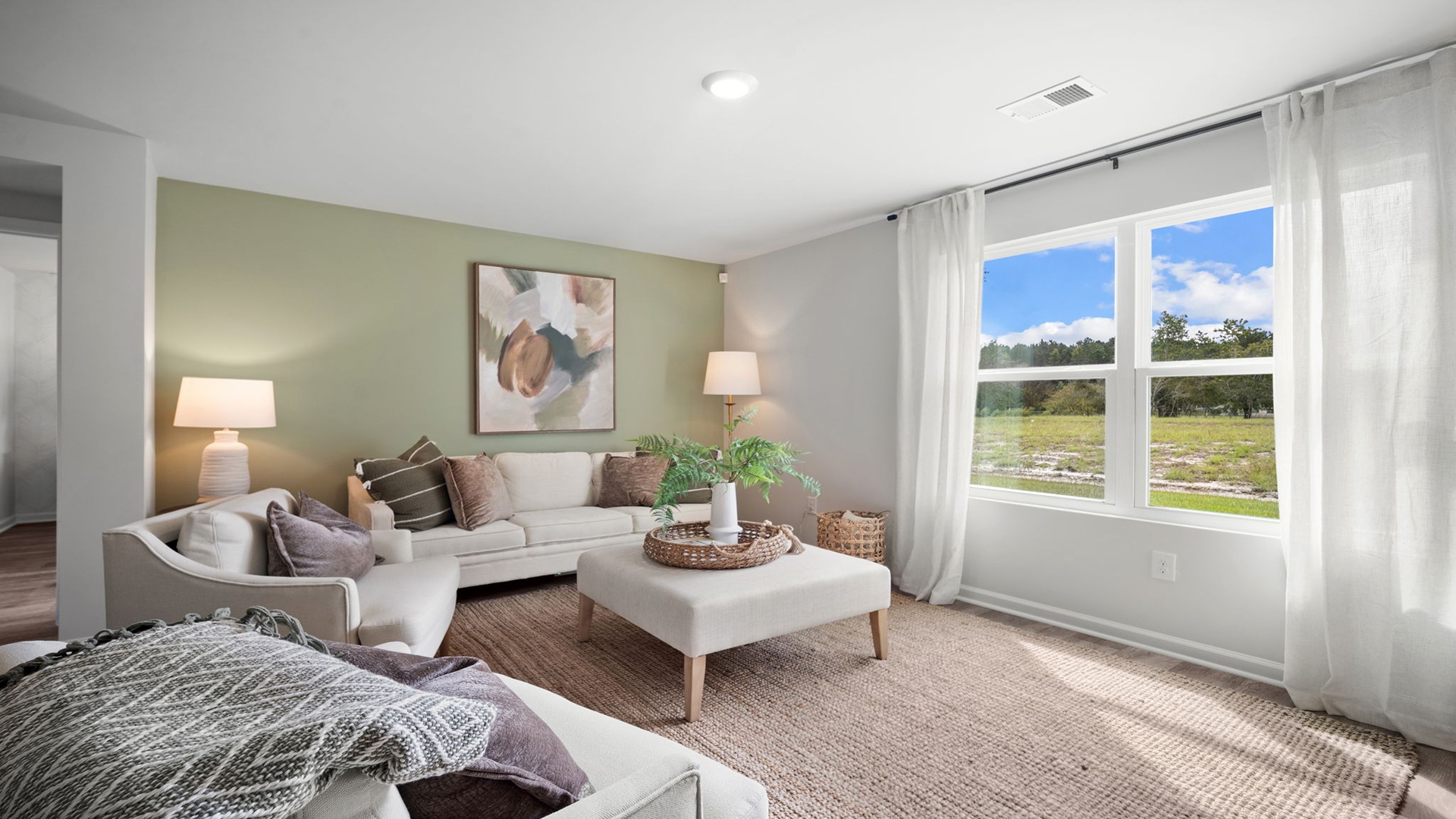 Living area with large windows for natural lighting.