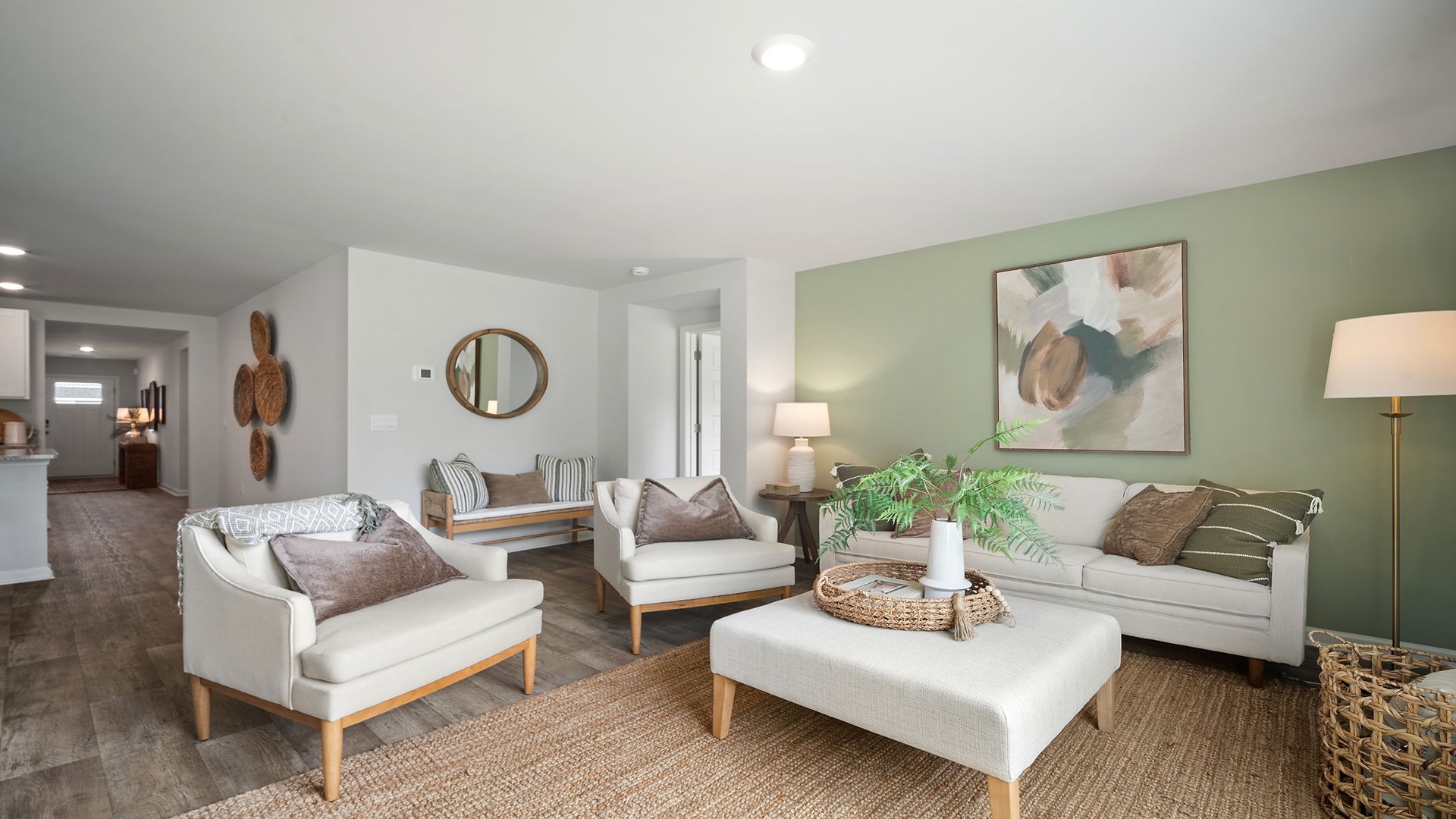 Spacious living area with large windows for natural lighting.