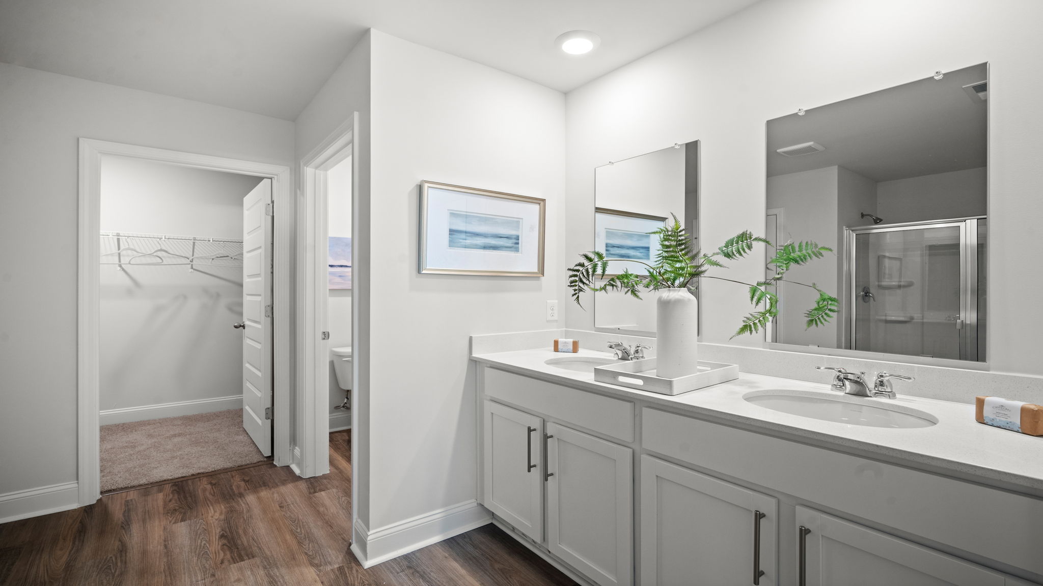 Well-appointed bathroom offering a clean, modern aesthetic and practical storage solutions.