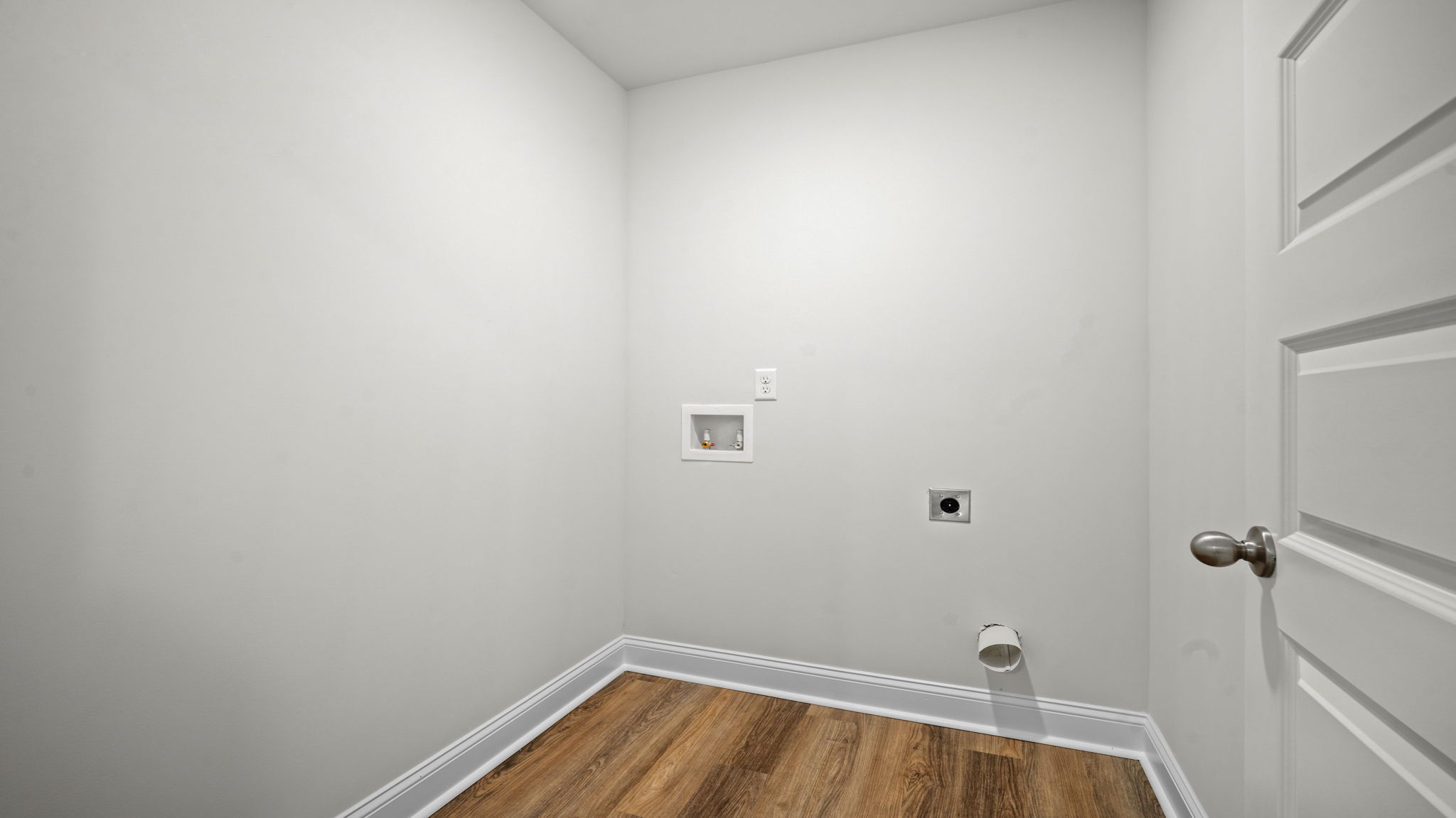 Convenient upstairs laundry room located near the bedrooms for enhanced household efficiency.