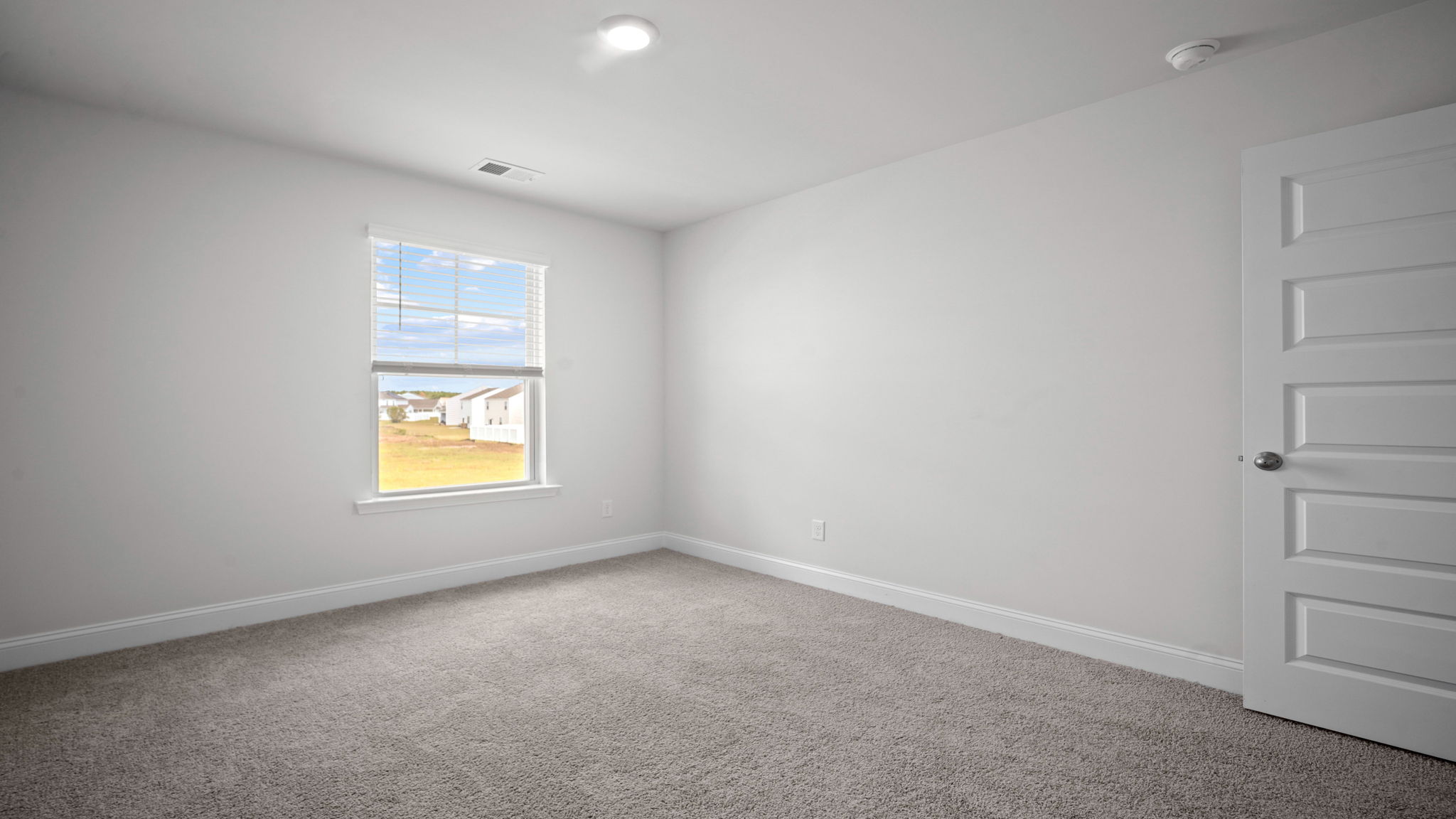 Well-appointed secondary bedroom ideal for family members, overnight guests, or work-from-home needs.