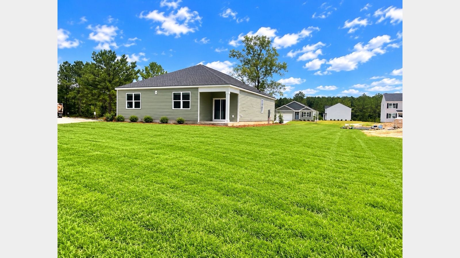 Large grassy back yard in Hardeeville Cypress Landing community with kayak dock and area for RV or Boat parking