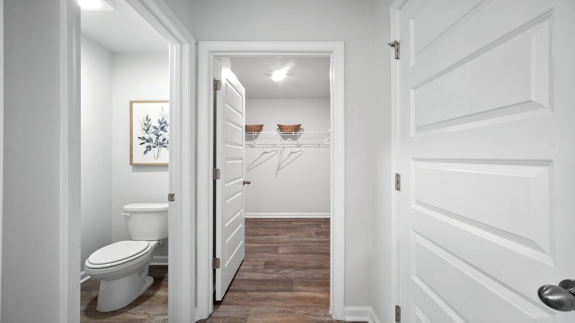 Primary bathroom with double vanities and a stand-up shower