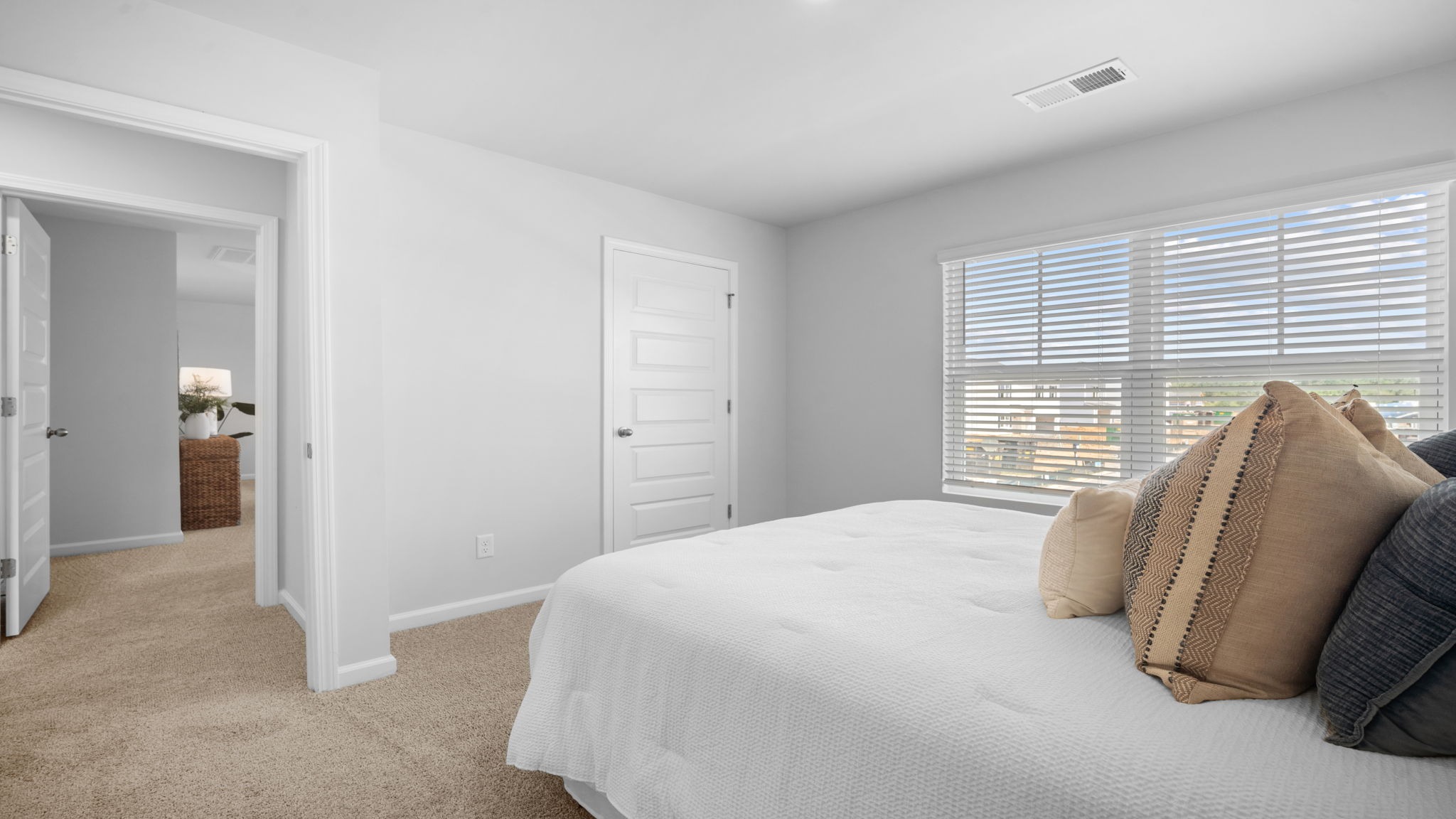 Guest bedroom decorated with a bed and a side table
