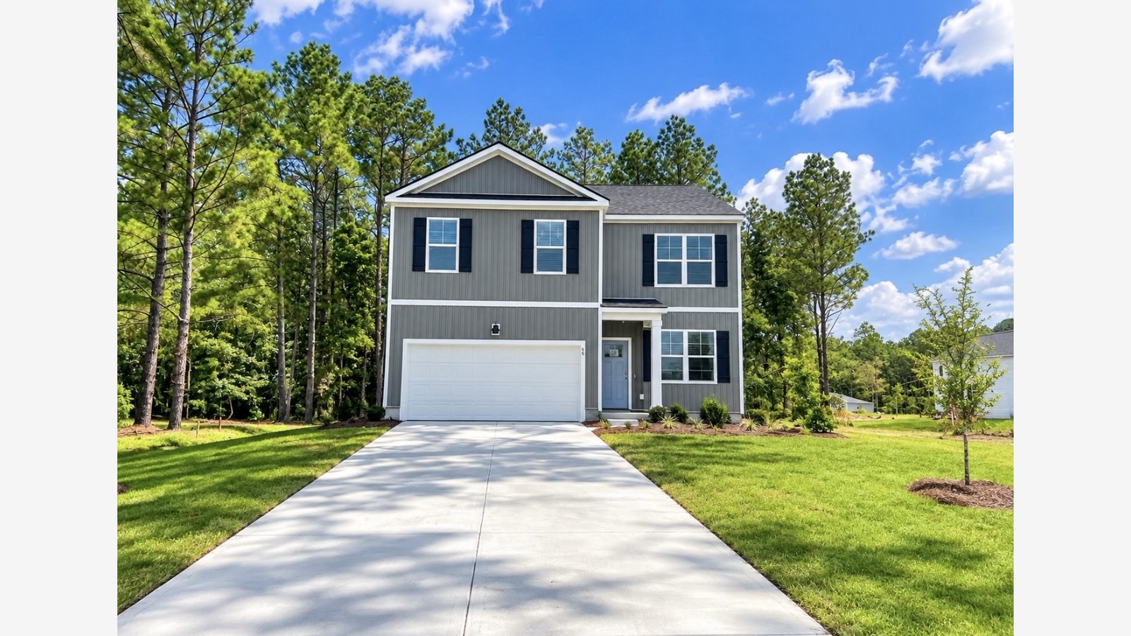 Behaven C Front side view of home in Hardeeville SC neighborhood with long driveway and big front yard