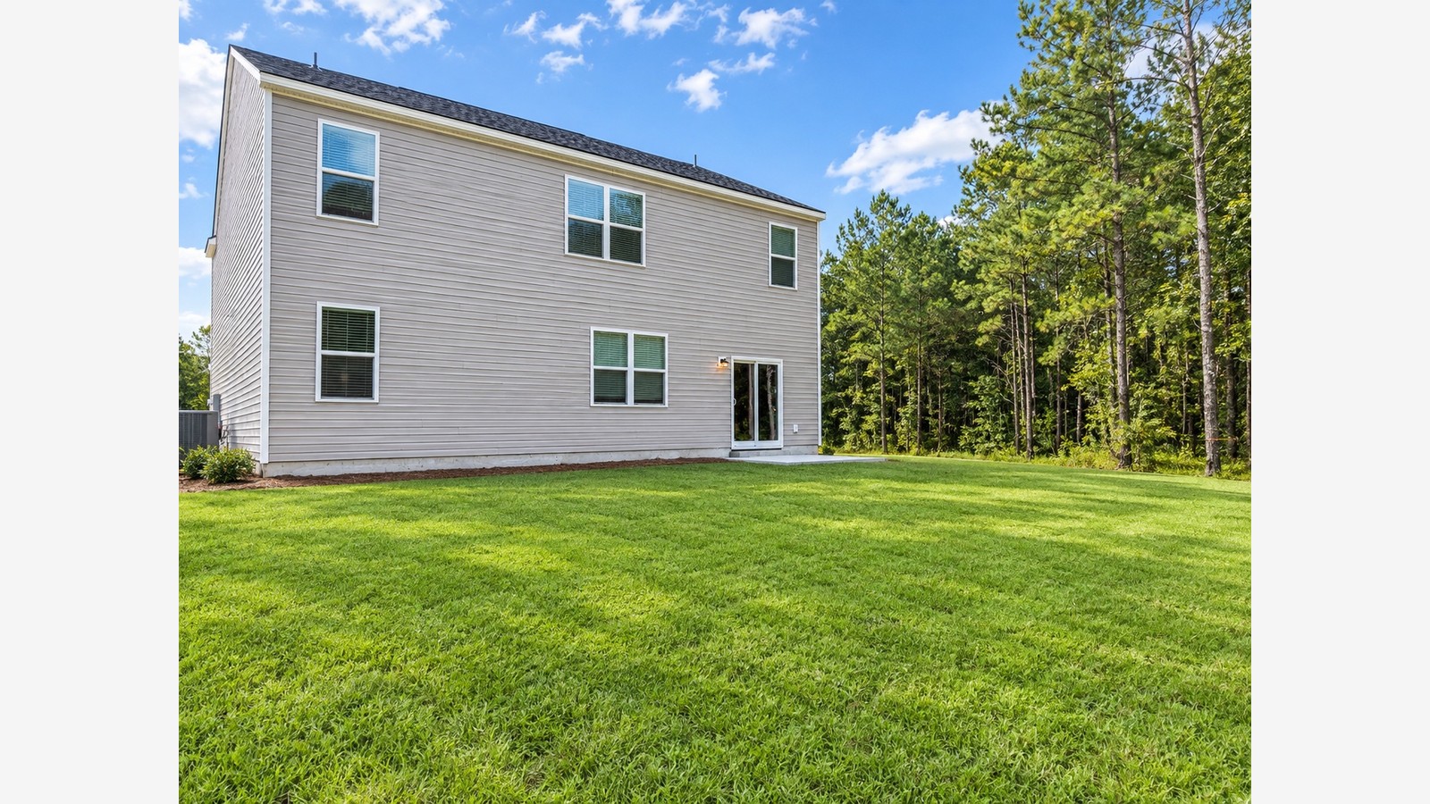 Hayden C Large back yard and rear exterior of home in Cypress Landing community in Hardeeville