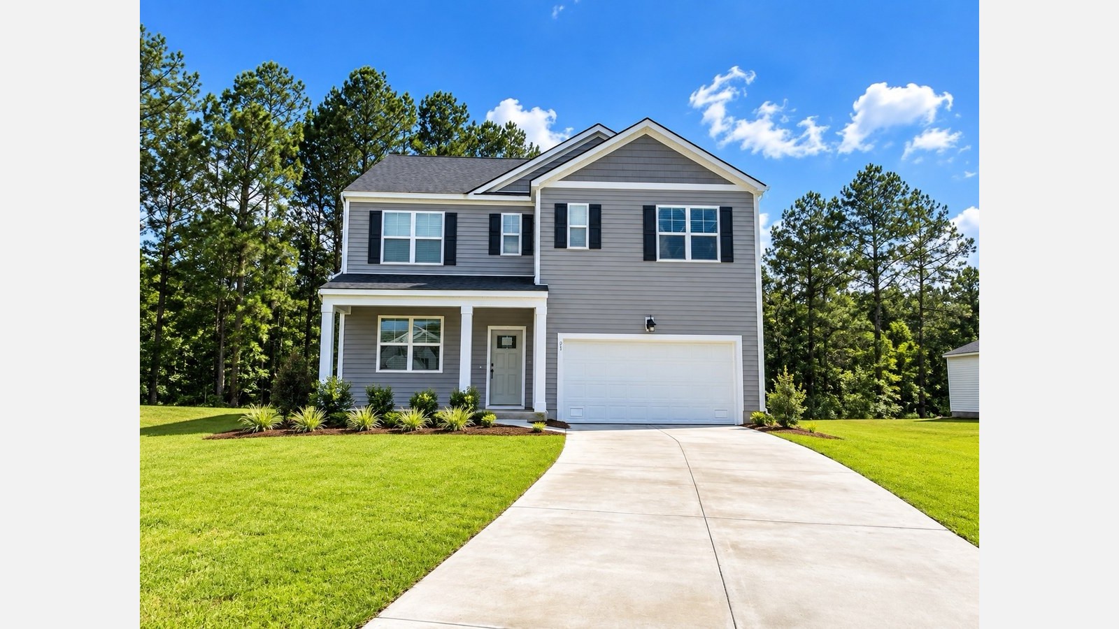 Hayden B Front Exerior in Cypress Landing with large green grass yard in the front and back