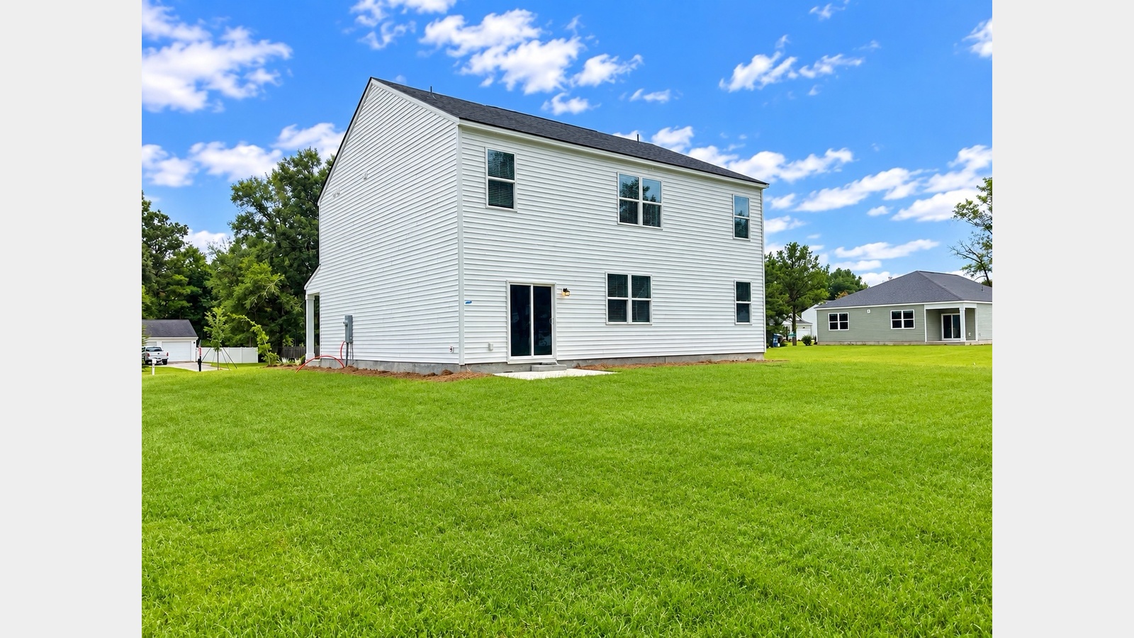 Rear exterior with large yard and room for RV or Boat