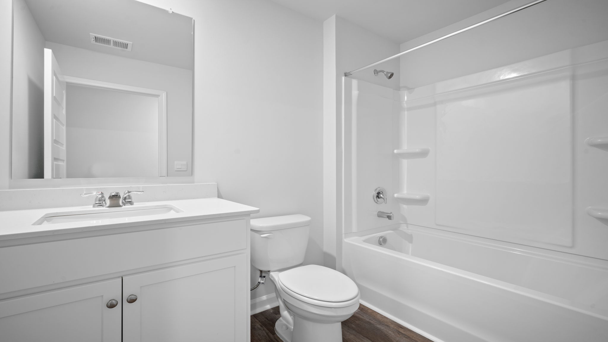 Guest bathroom with a tub shower