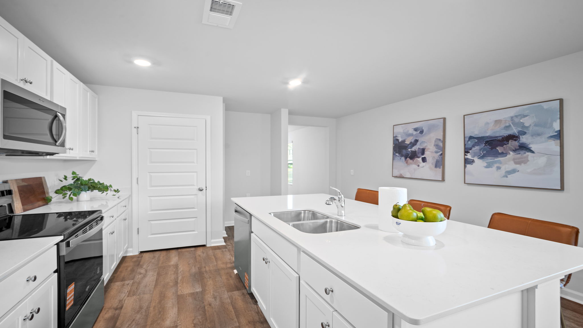 Kitchen with a stainless dishwasher and an oven range