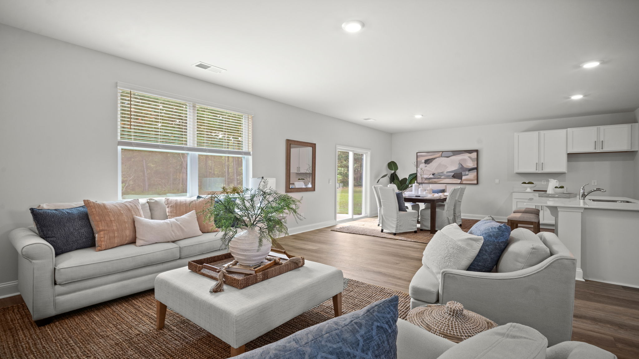 Living area with kitchen and dining area in the back.