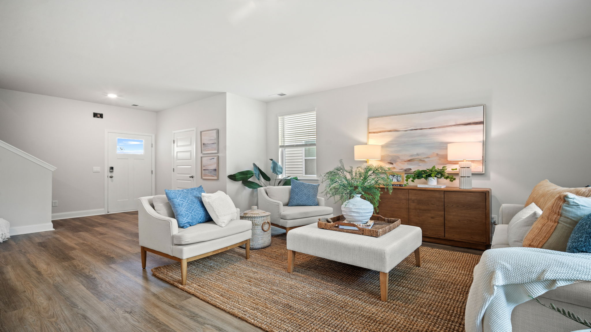 Spacious living area with large windows for natural lighting.