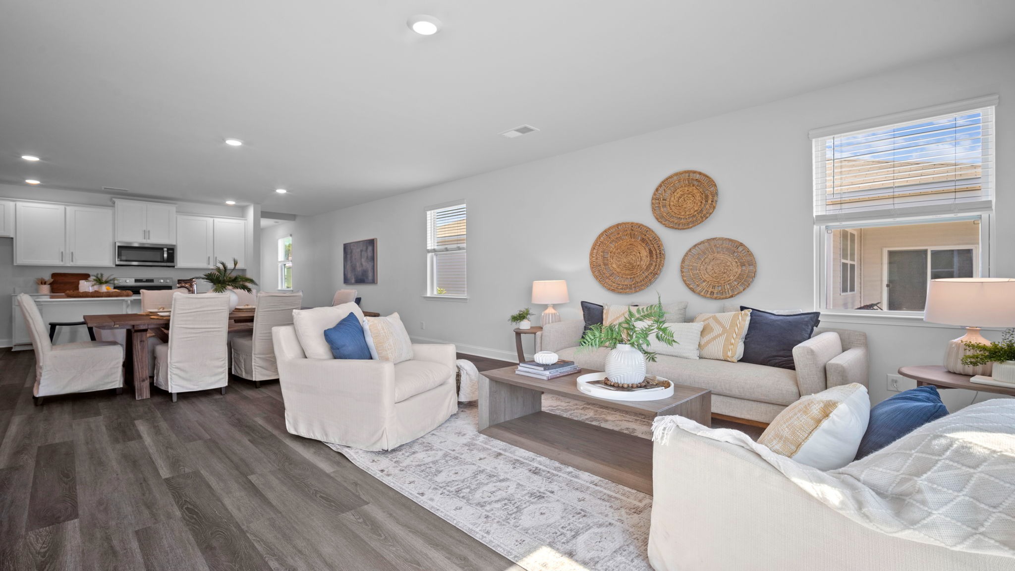 Living room of home decorated with a couch, tables and seating