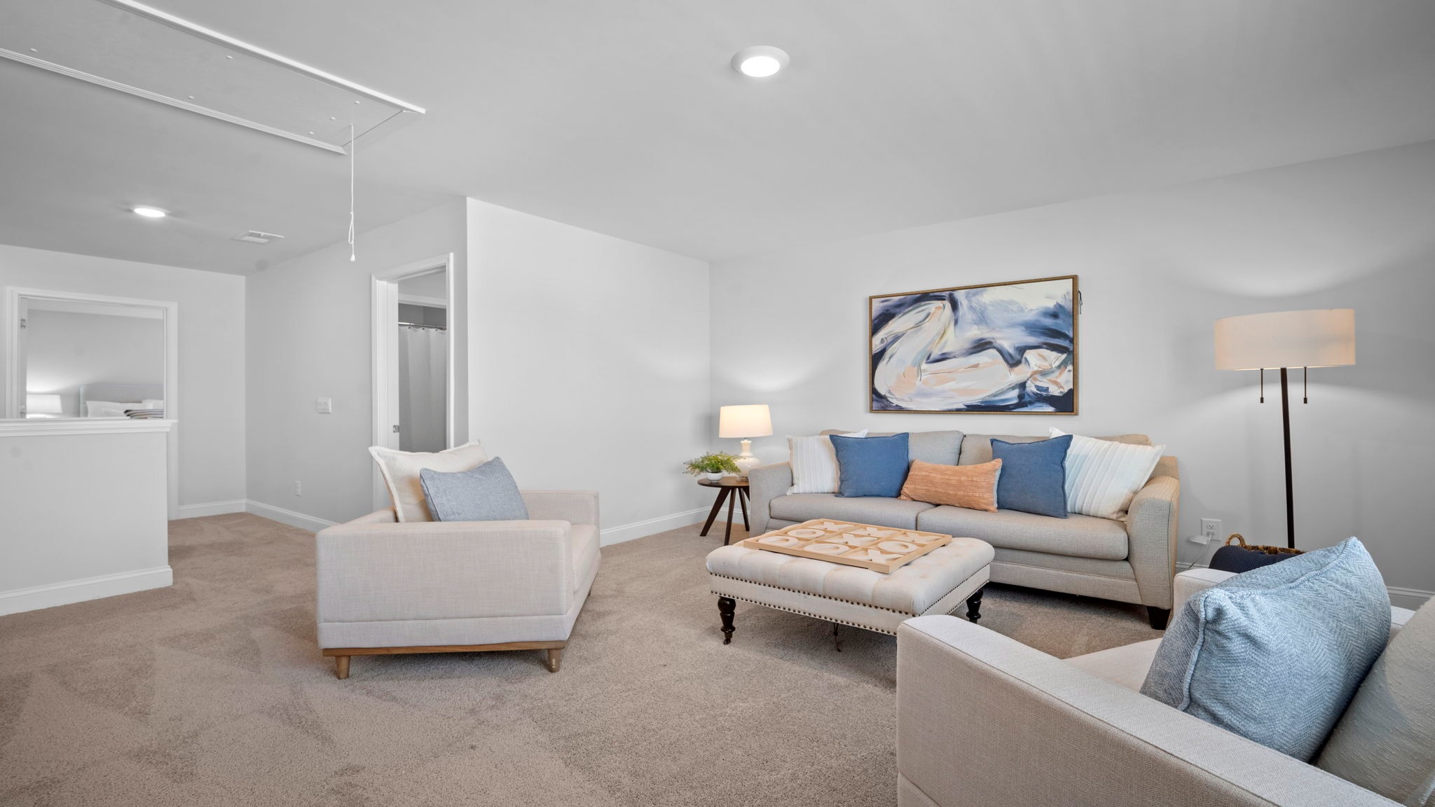Upstairs living room decorated with seating