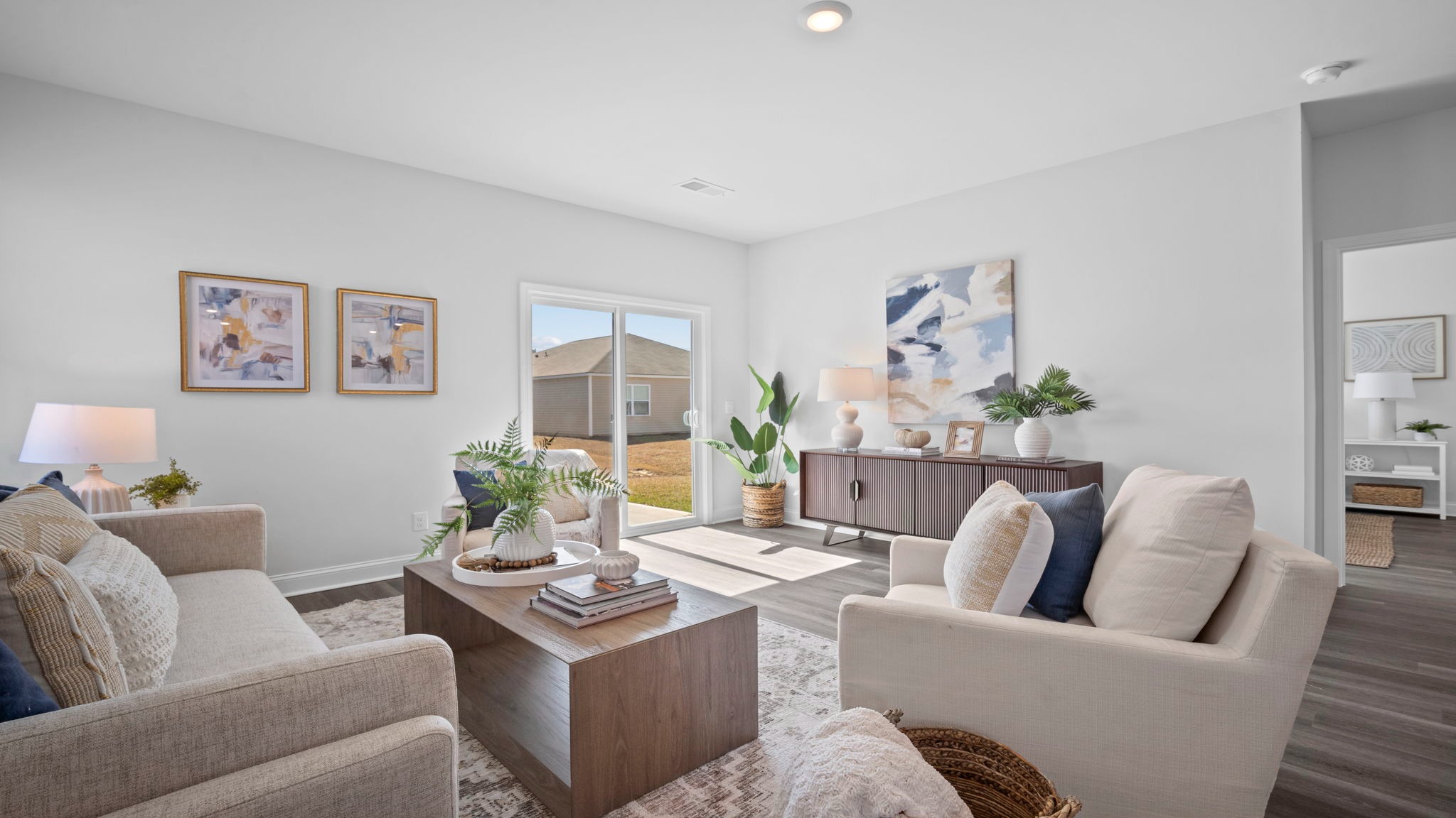 Living room of home decorated with a couch, tables and seating