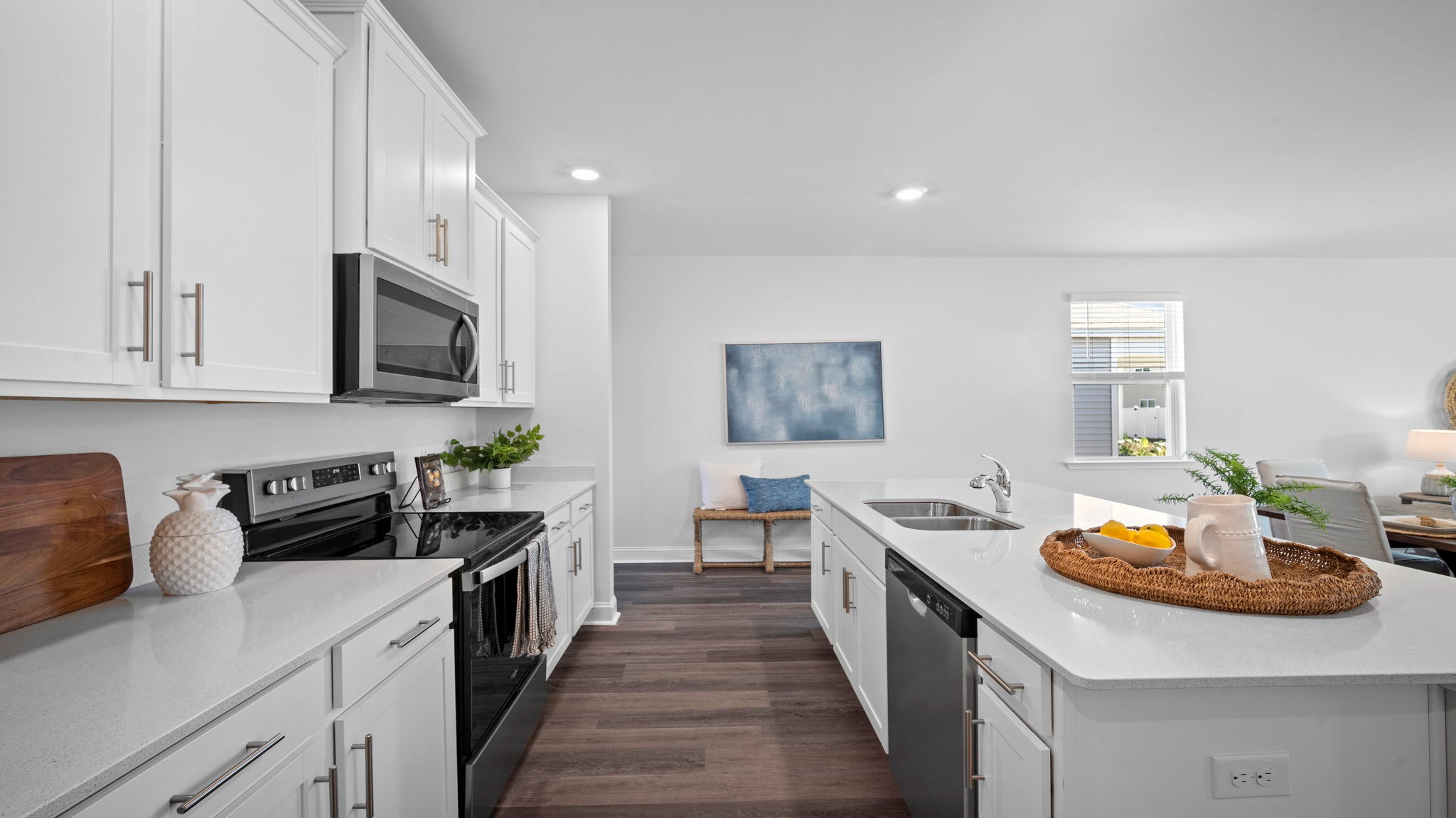 Kitchen view of both countertops looking towards the front of the home