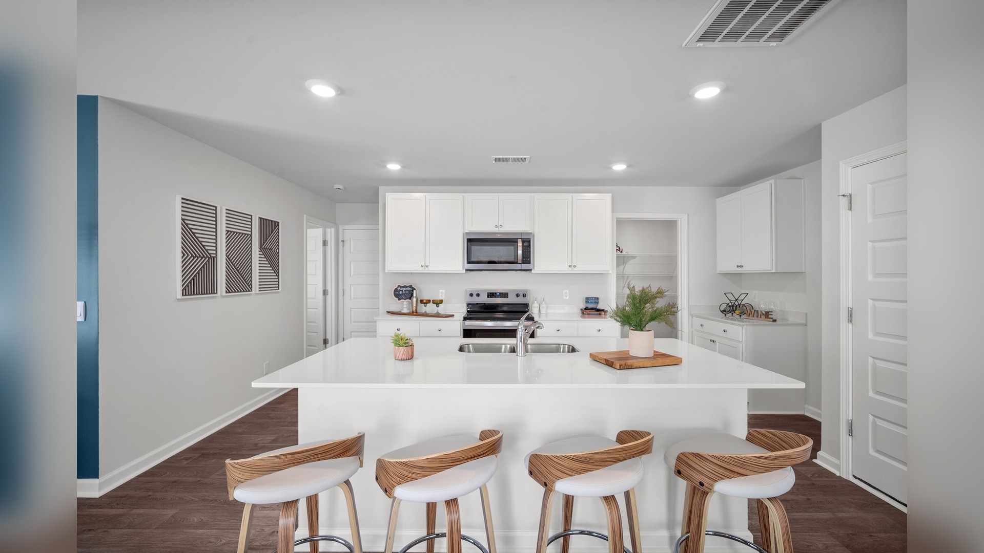 Kitchen view of the island with bar seating
