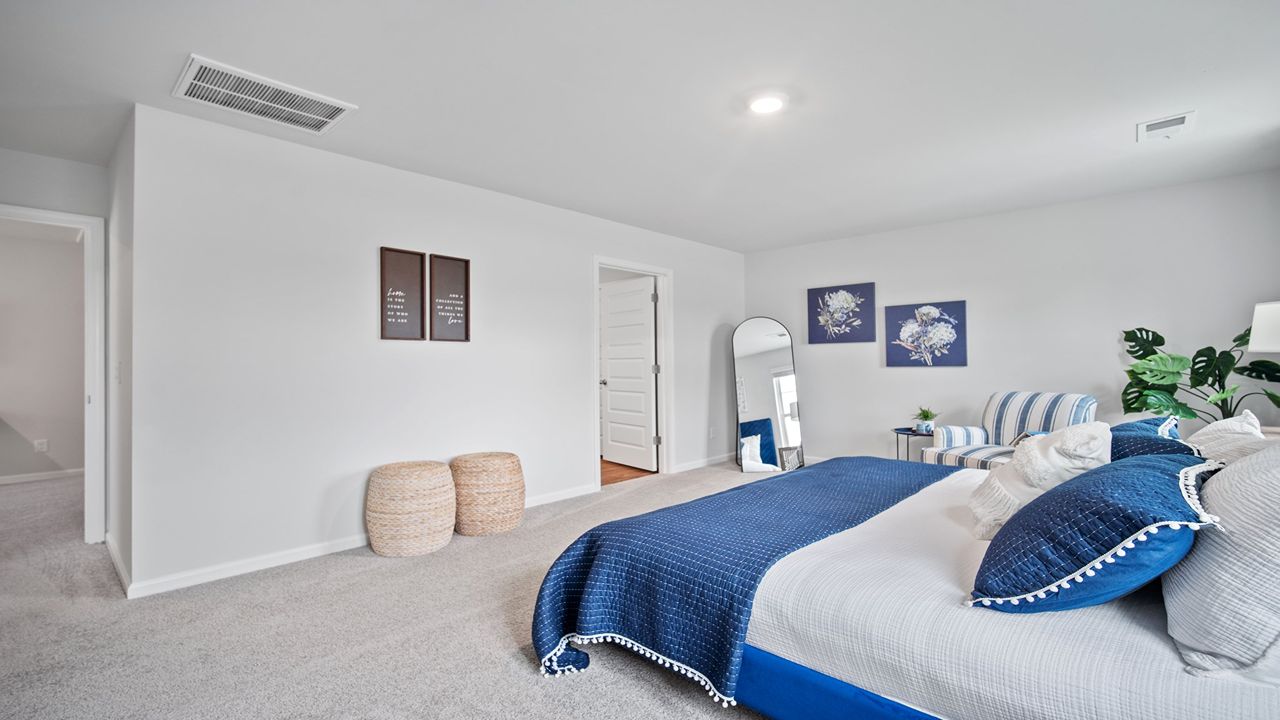 Additional view of the primary bedroom and connected spaces.