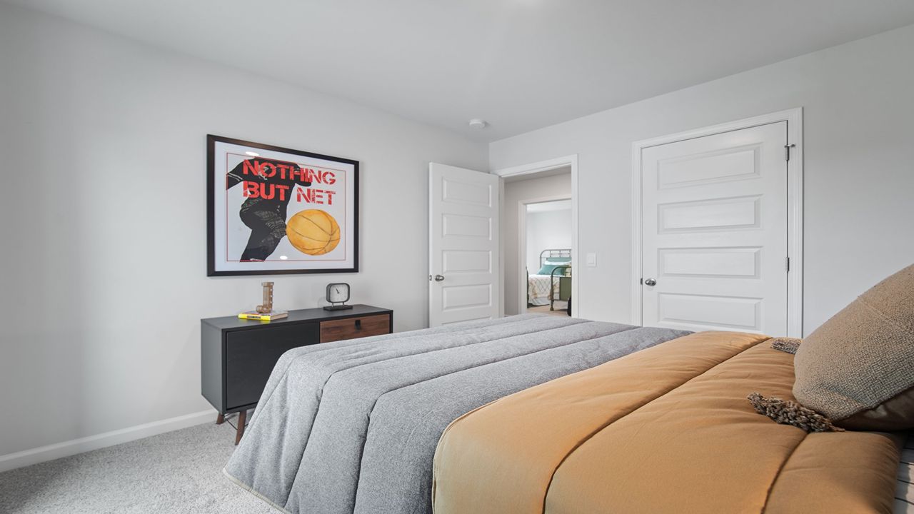 Alternate angle of the same guest bedroom showing furnishings.