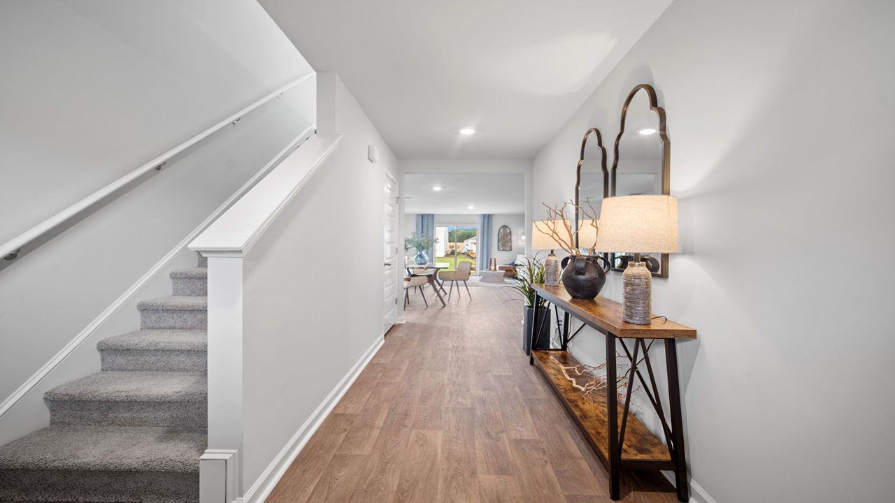 Foyer area showing a staircase leading to the upper level.